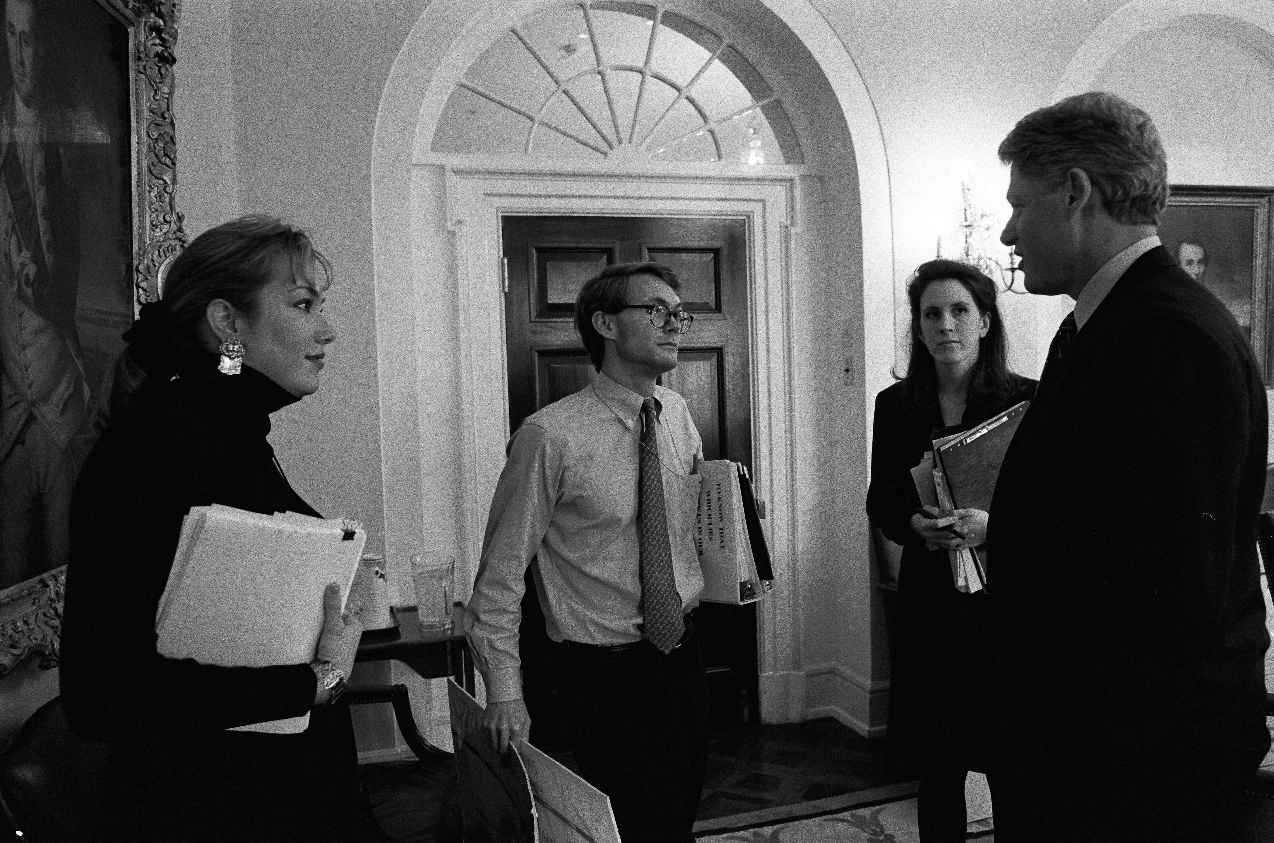 President Clinton speaks with Billy Webster, Stephanie Streett, and Anne Walley following a scheduling meeting.