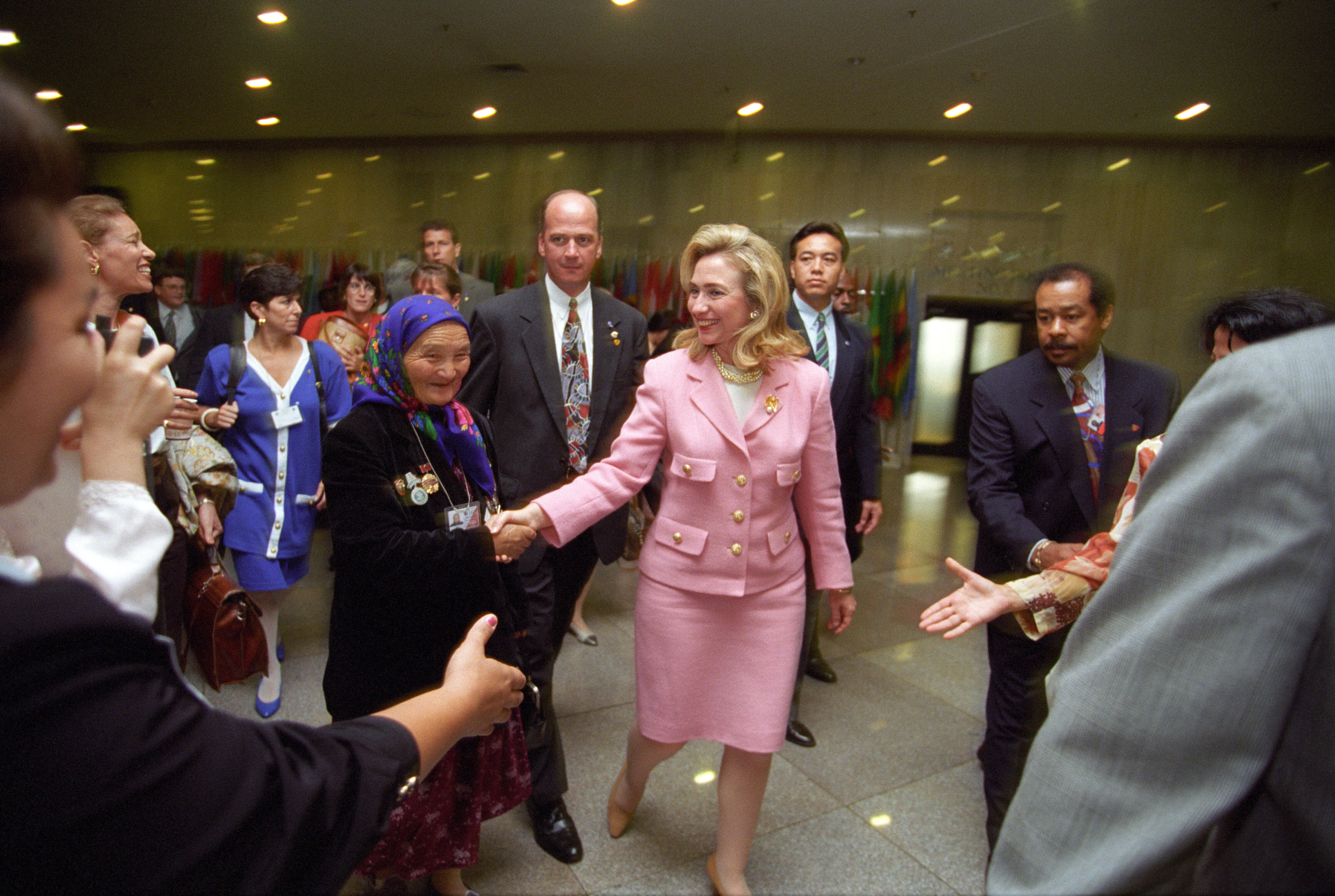 First Lady Hillary Rodham Clinton arrives at the Beijing Commodities Center for the Colloquium on Women and Health Security in Beijing, China