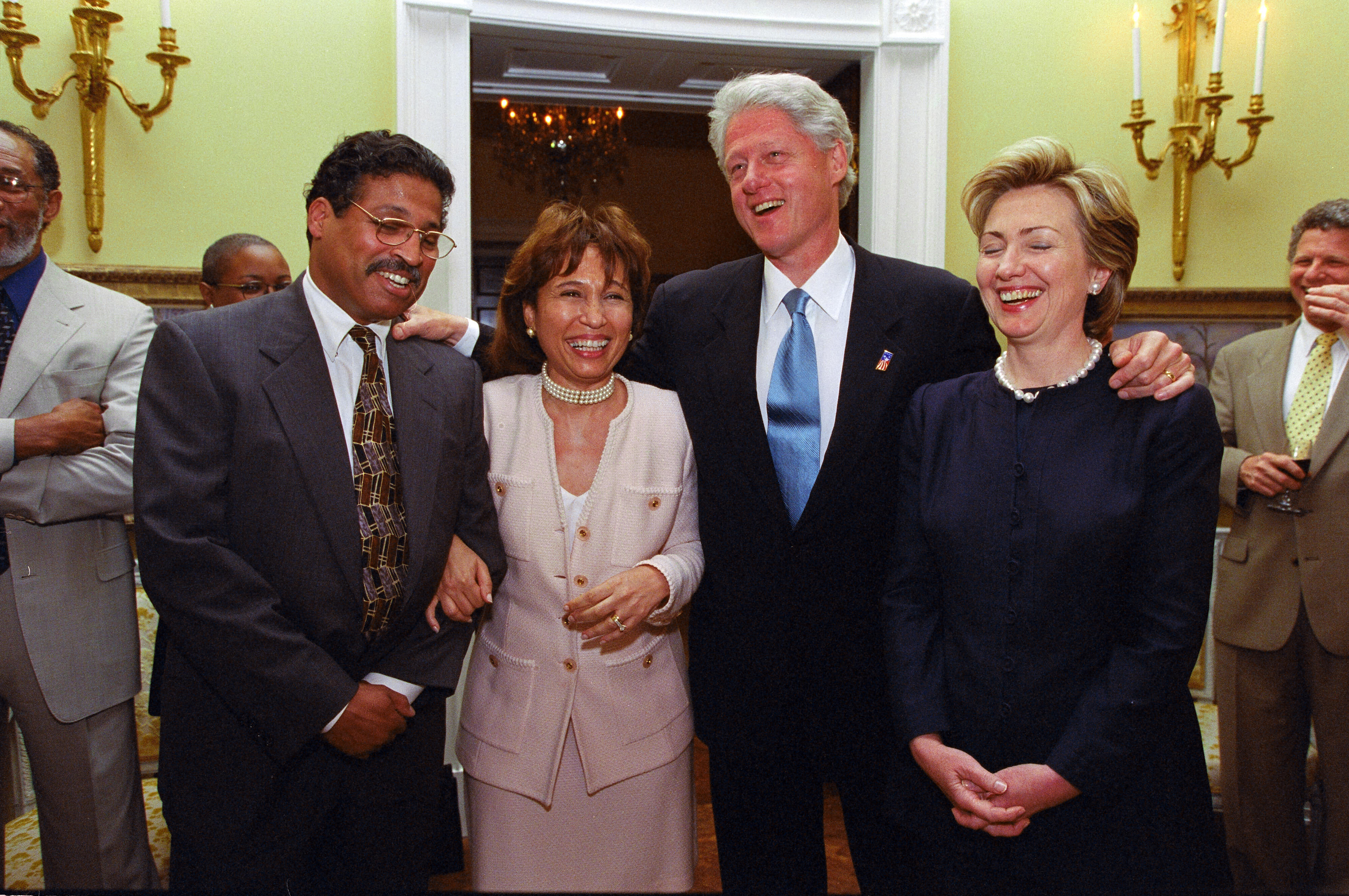 President Clinton and Hillary Rodham Clinton stand together and laugh with with Secretary of Labor, Alexis Herman, and her husband, Dr. Charles Franklin 