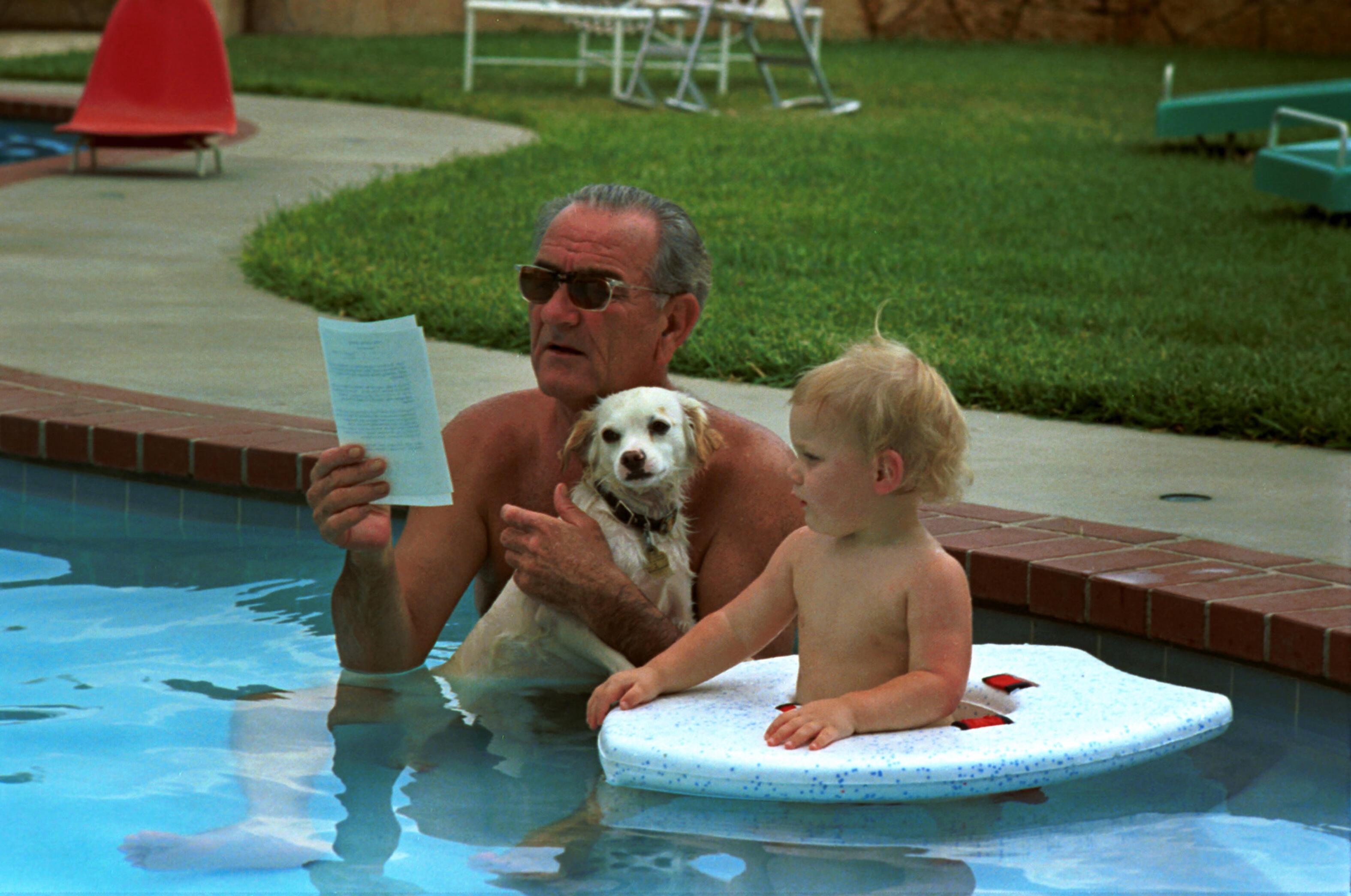 President Lyndon B. Johnson on his Birthday in Swimming Pool with his Dog and Grandson