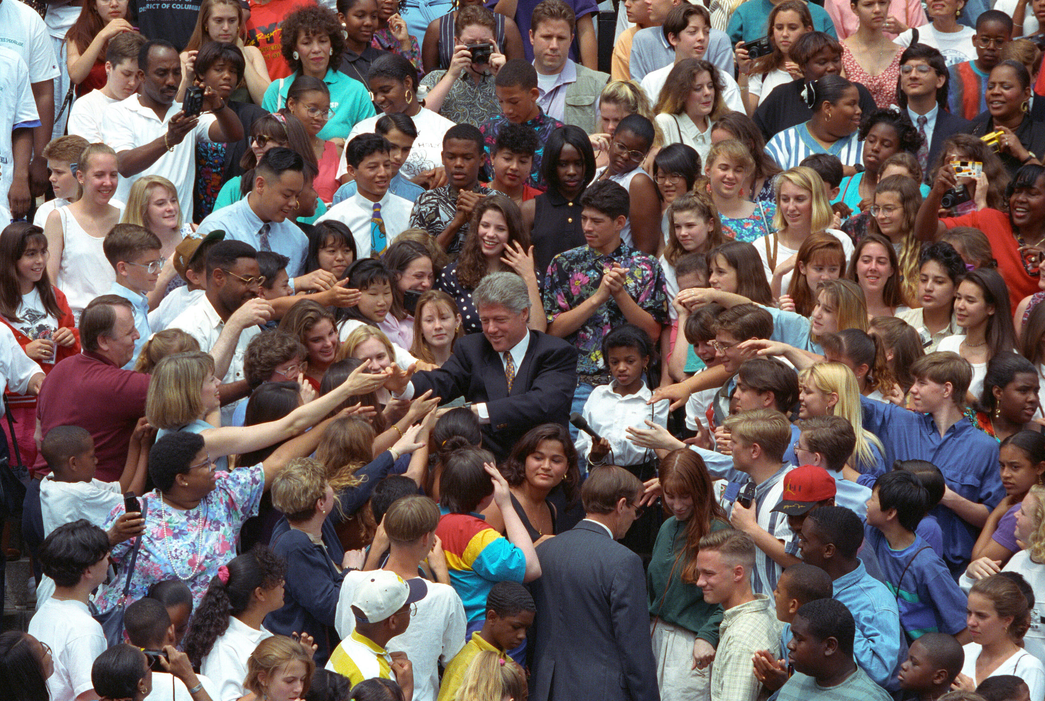 President William J. Clinton greeting hundreds of volunteers as he makes an appearance on West Executive Avenue
