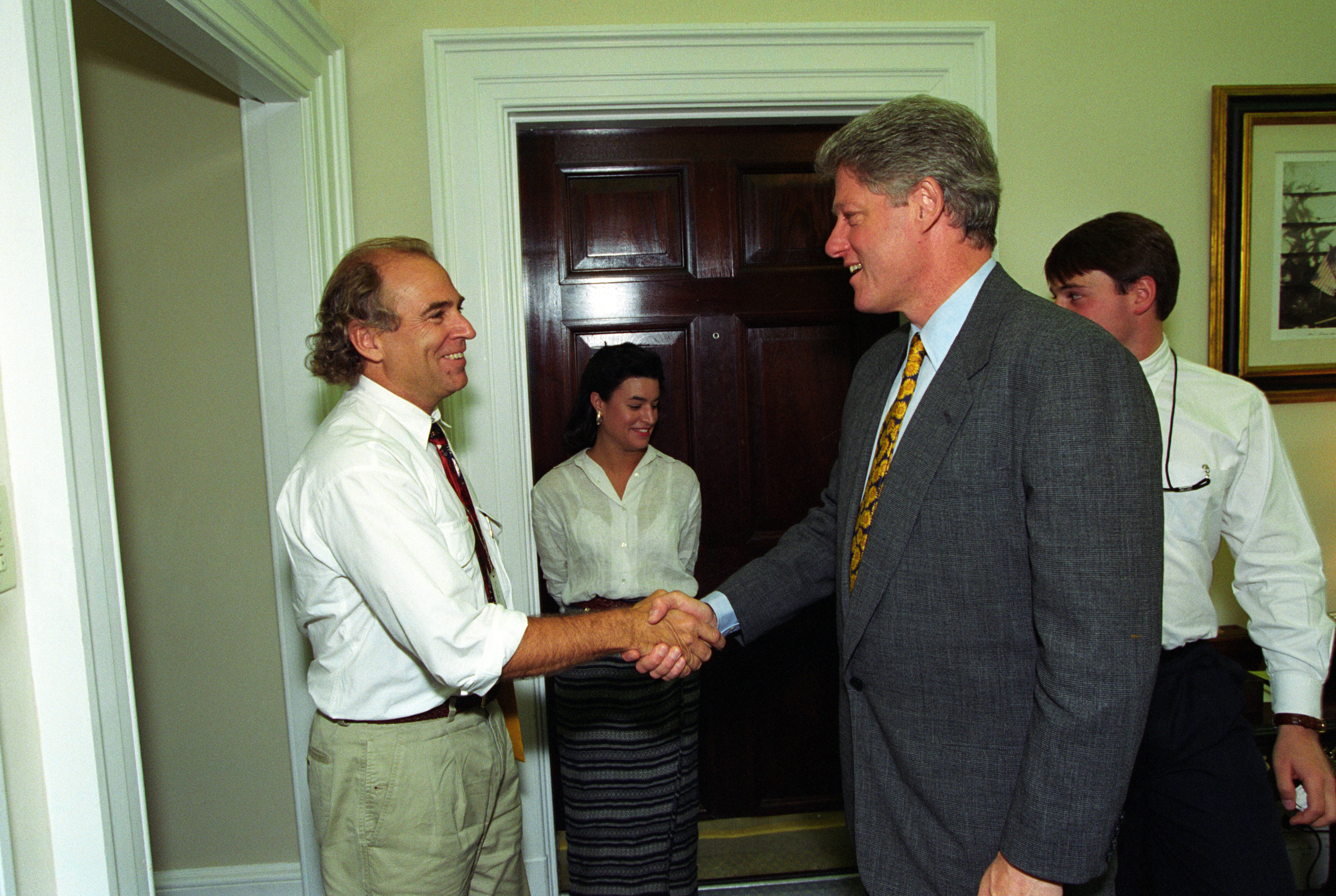 President Clinton greets musician Jimmy Buffet in the Outer Oval Office area.