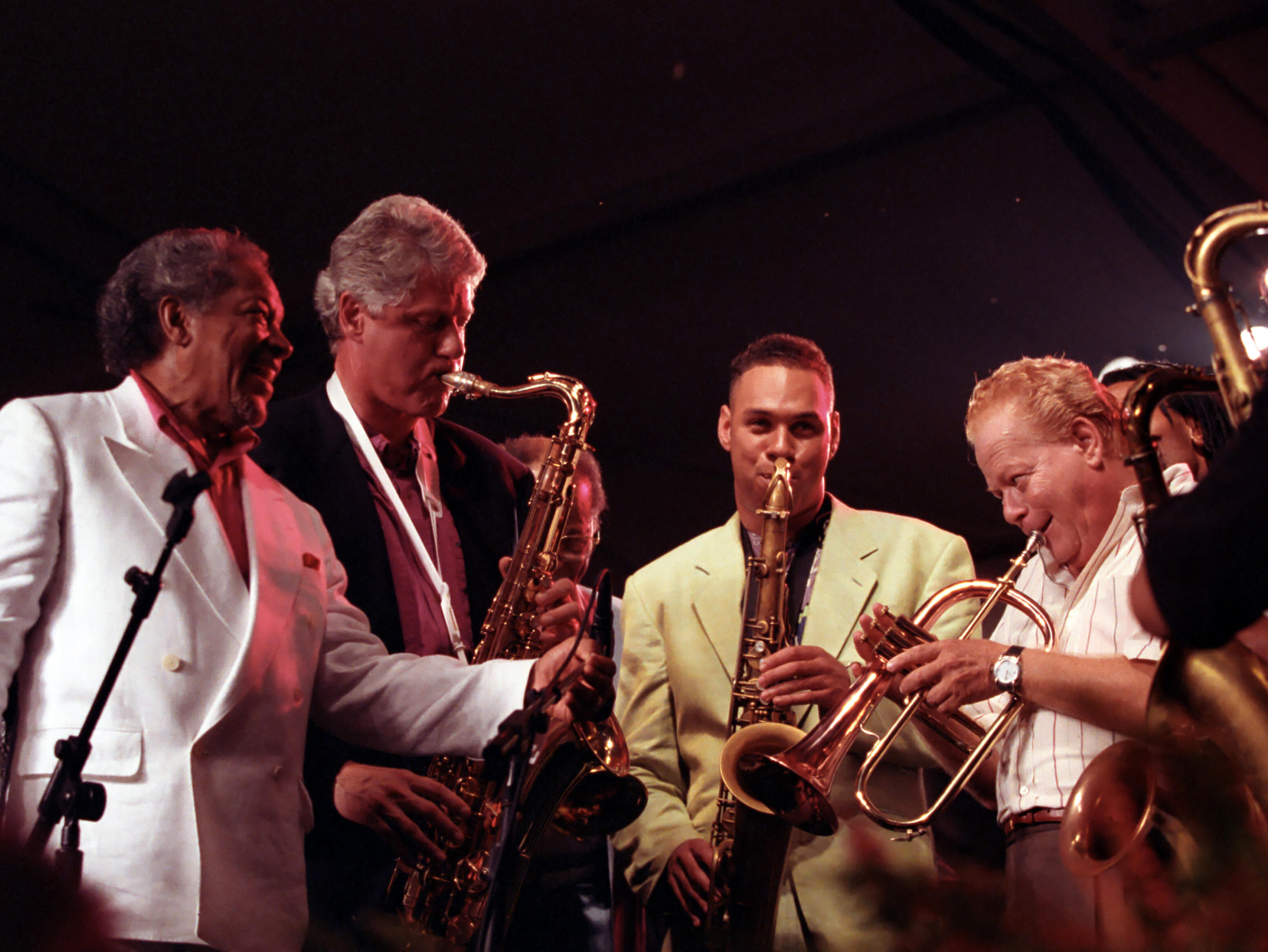 President Clinton plays the saxophone with jazz musicians at the 14th anniversary of the Newport Jazz Festival on the South Grounds