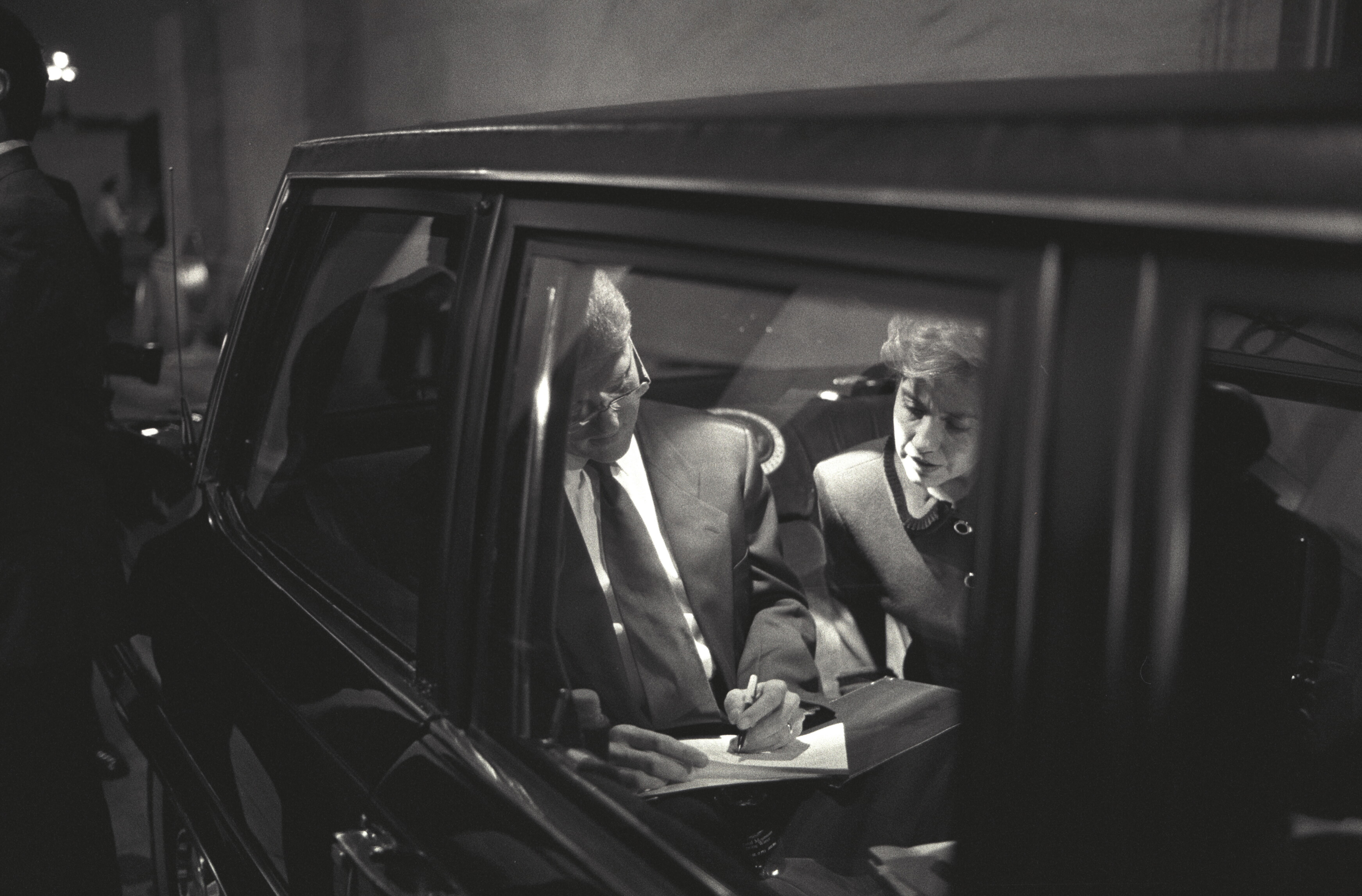 President Clinton and First Lady Hillary Rodham Clinton working in the limousine ride over to Capitol Hill. President Clinton and the First Lady are traveling to the capitol for President Clinton to address Congress concerning Health Care
