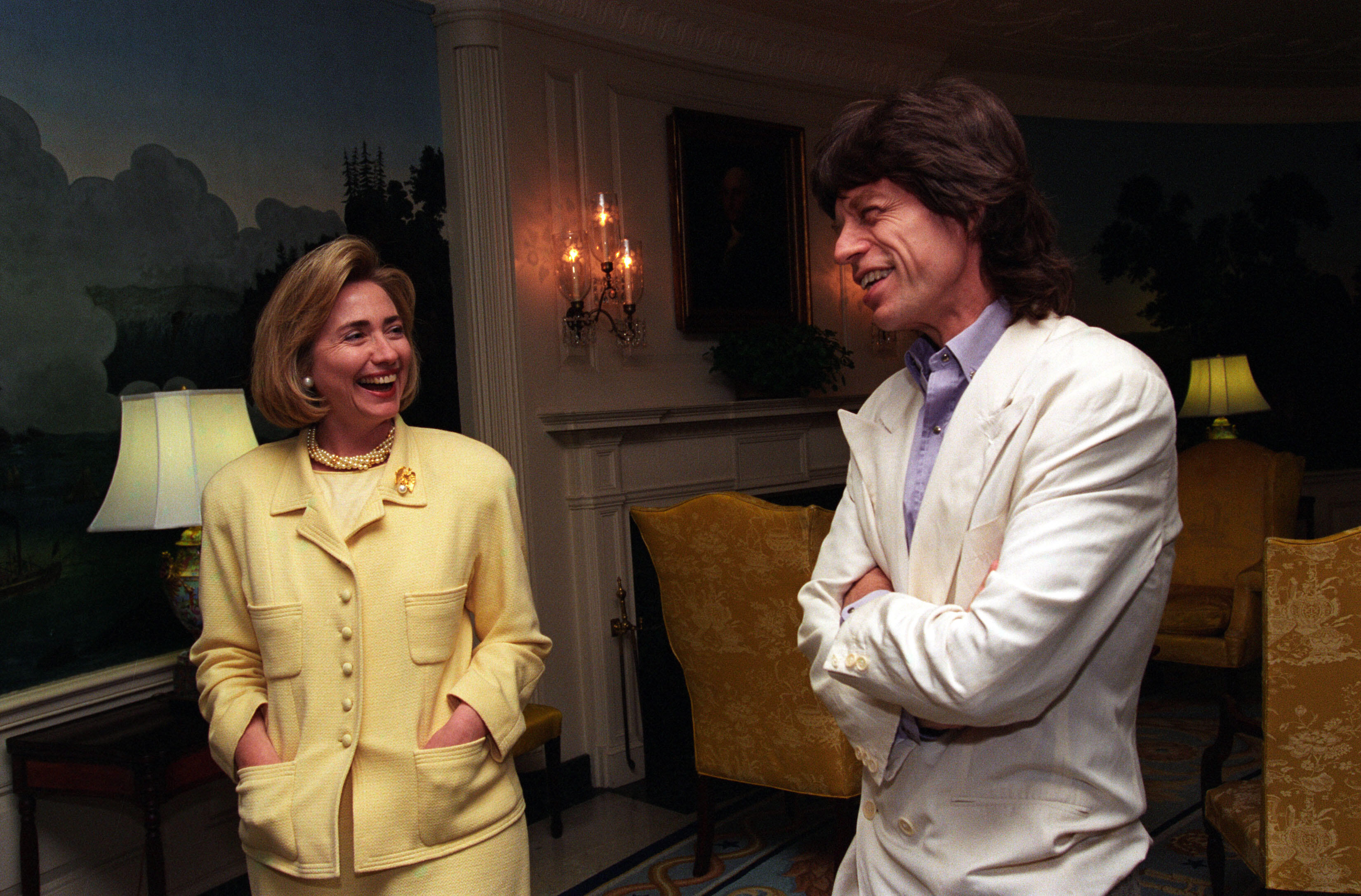 Musician Mick Jagger shares a laugh with First Lady Hillary Rodham Clinton during his visit to the White House