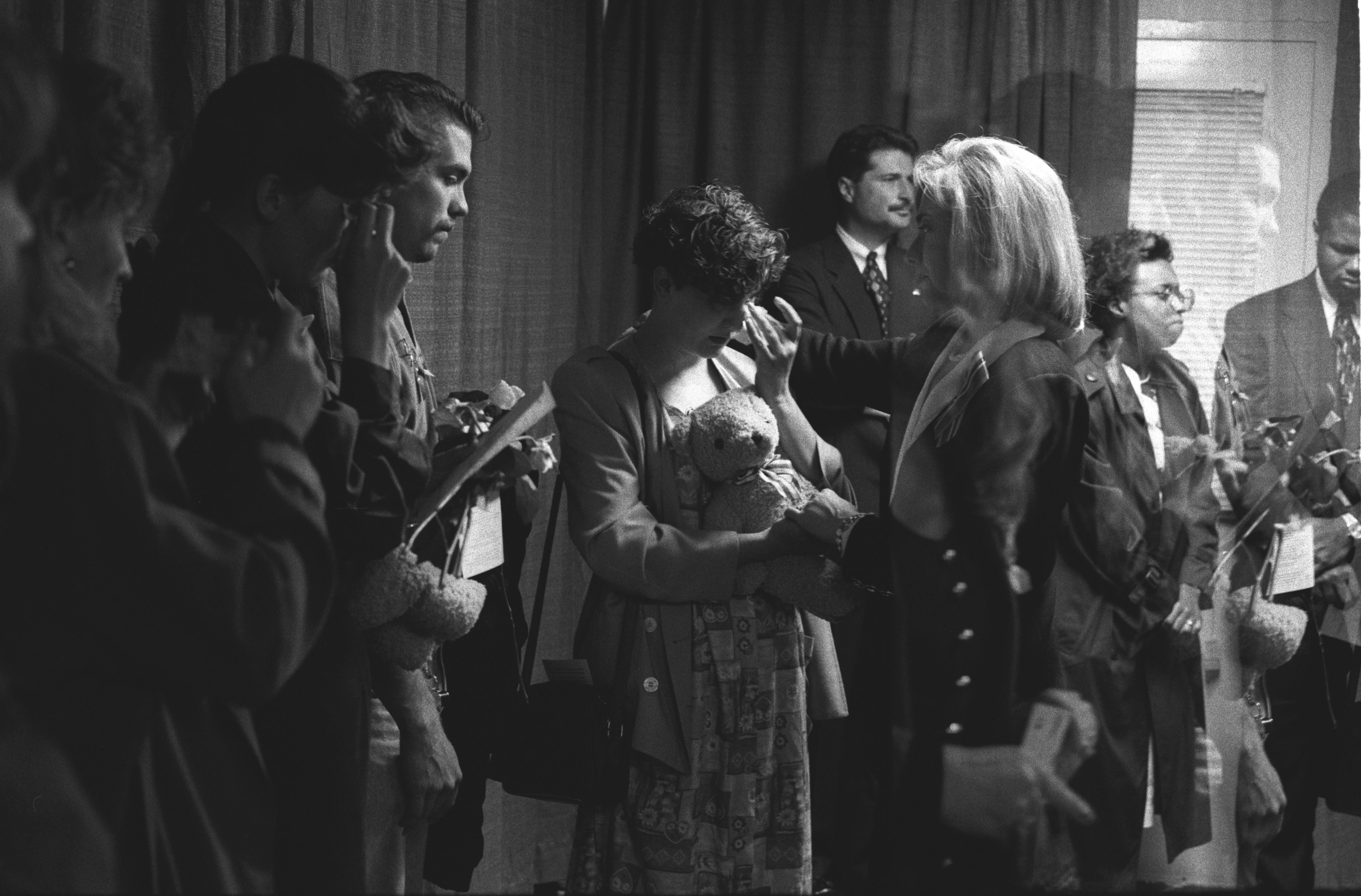 First Lady Hillary Rodham Clinton consoles families at a memorial service for the victims of the bombing of the Murrah Federal Building in Oklahoma City