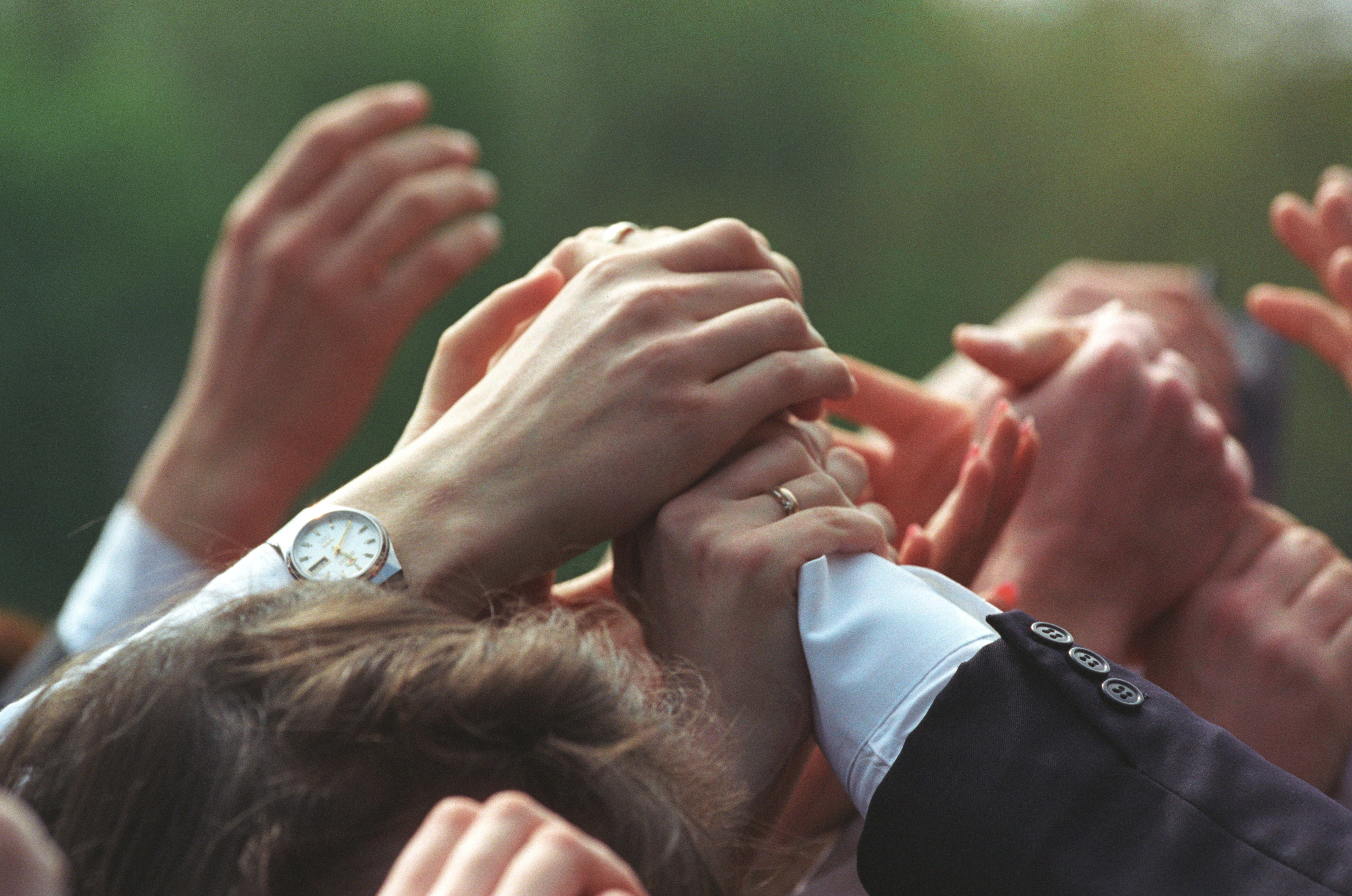 Hands in the air. President Clinton shakes hands with students at Shevchenko University in Kiev, Ukraine
