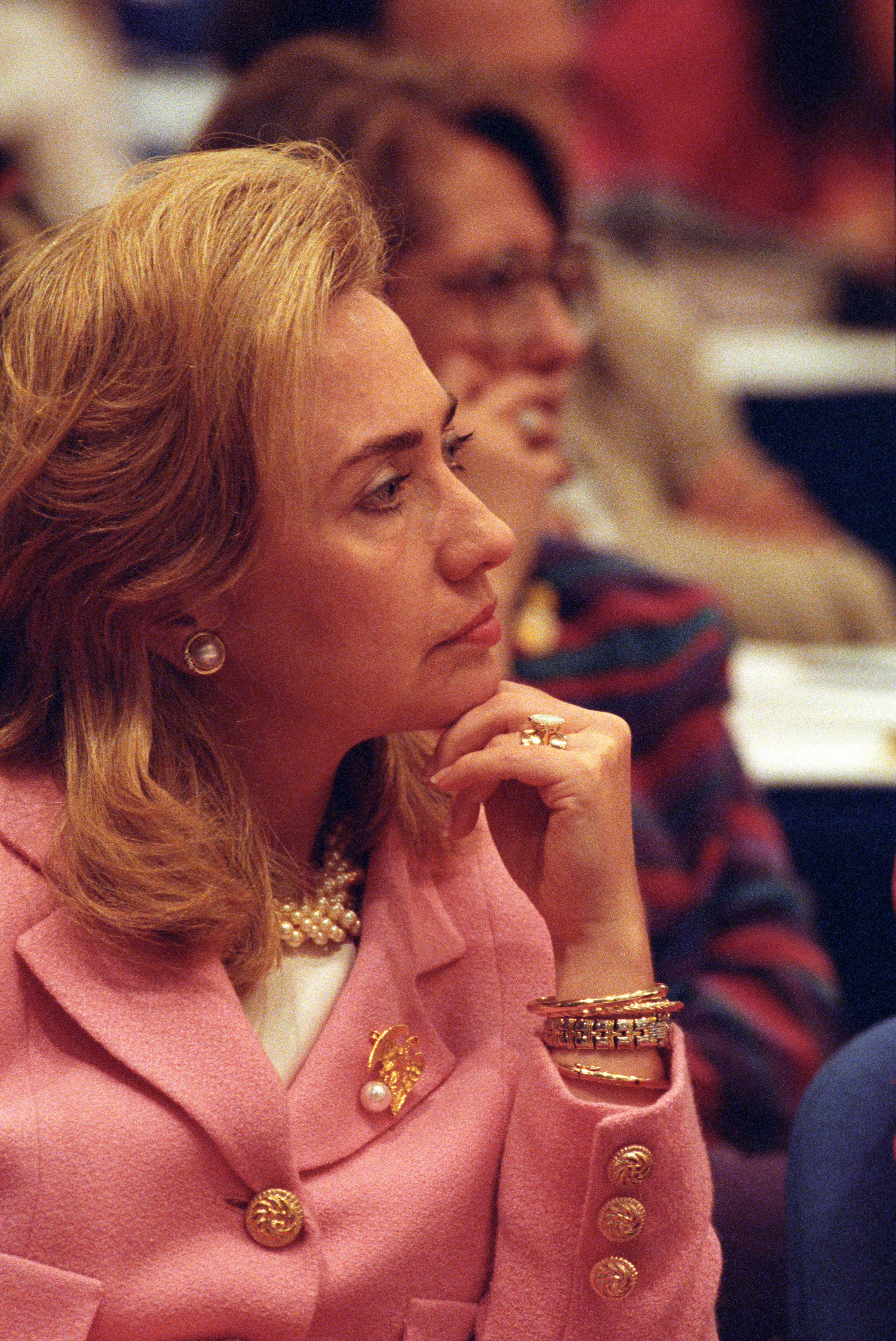 Hillary Rodham Clinton listens to remarks given at the Colloquium on Women and Health Security in Beijing, China