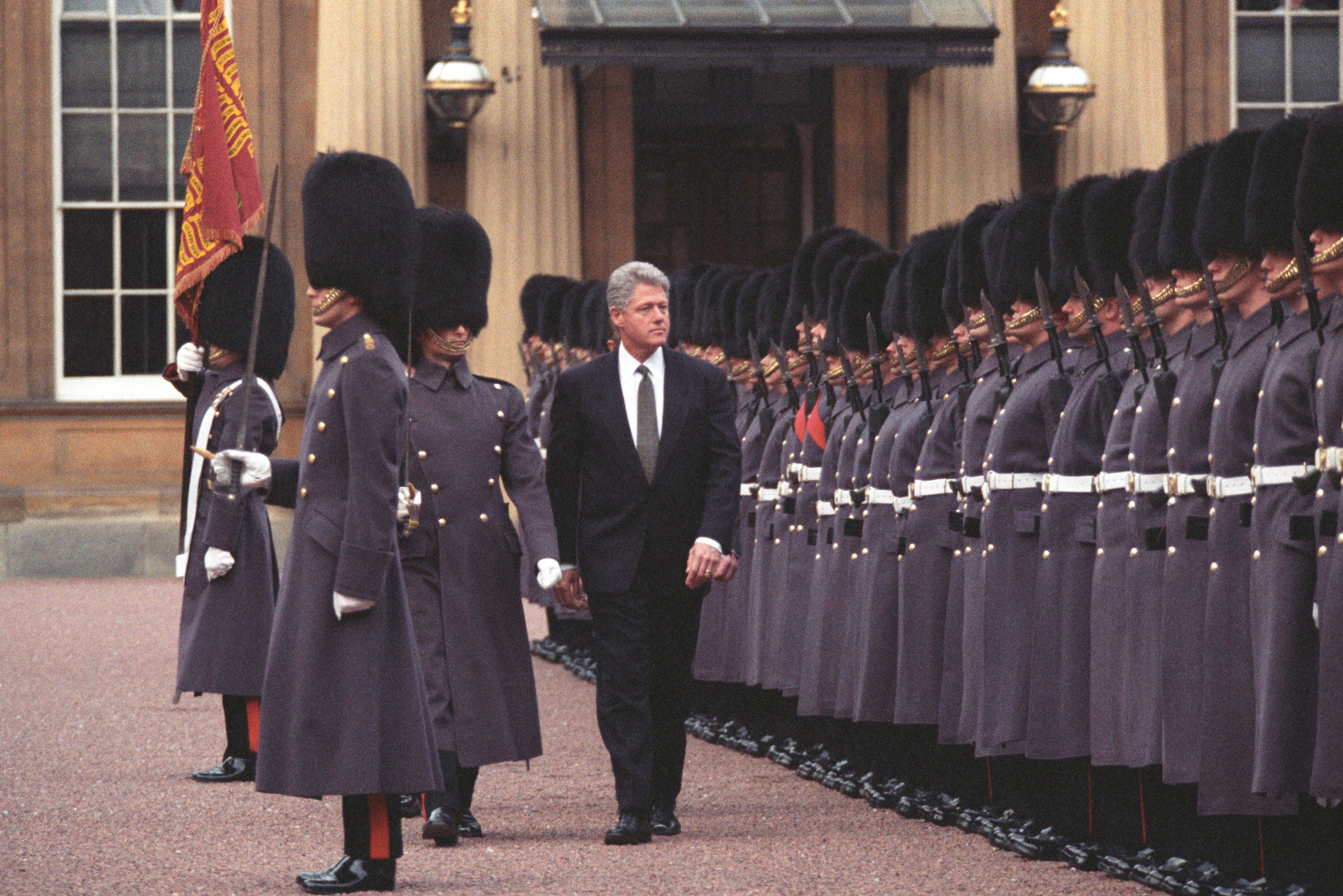 President Clinton and Prince Philip inspect the Queen's Guard at Buckingham Palace, London