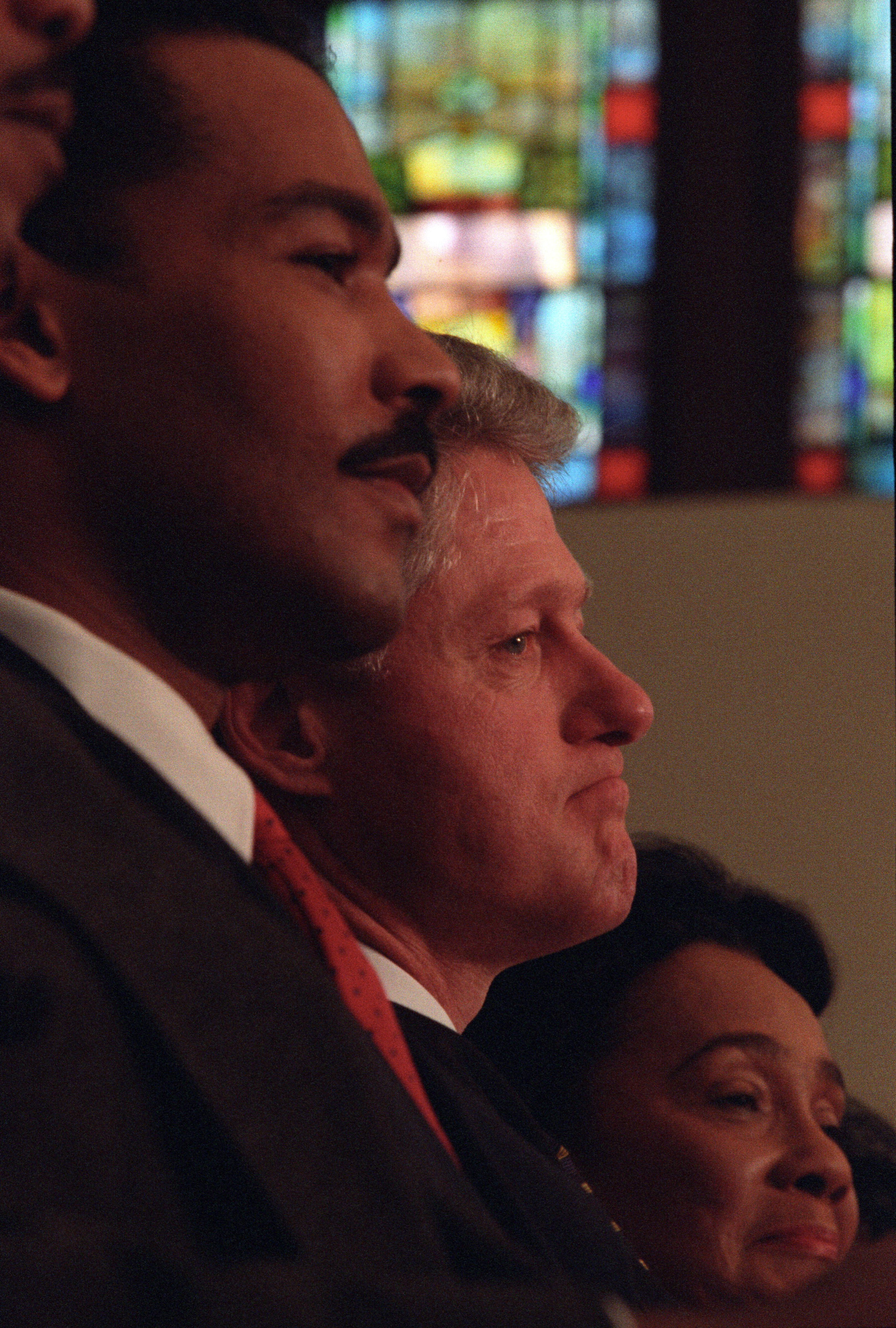 President Clinton attends a Martin Luther King, Jr. Commemorative Service at Ebenezer Baptist Church in Atlanta, Georgia. He is seated with Coretta Scott King and Dexter King