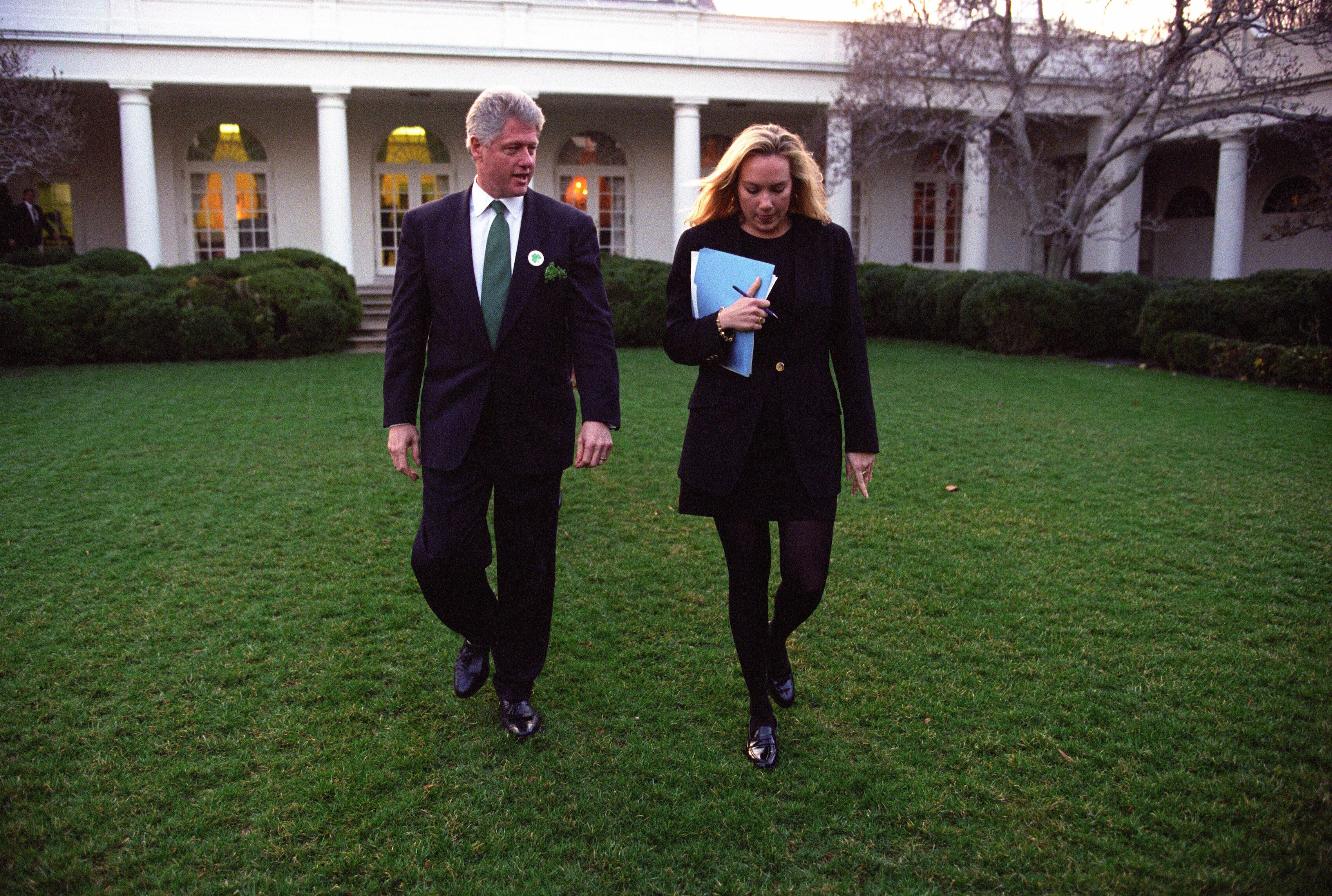 President Clinton walks across the White House Rose Garden with the Director of the Office of Scheduling, Stephanie Streett.