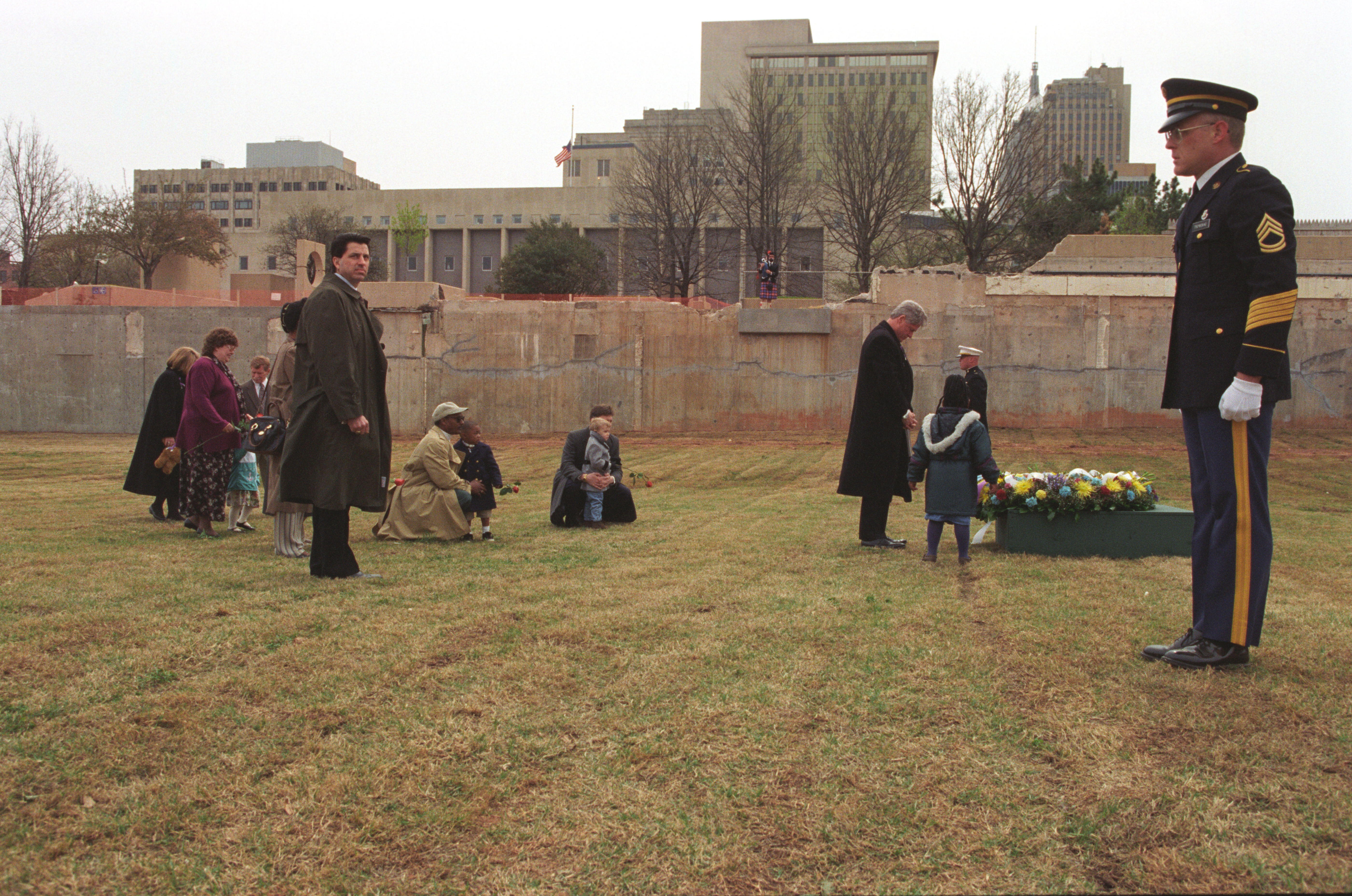 President Clinton participates in a wreath laying ceremony with bombing survivors at the former site of the Murrah Federal Building in Oklahoma City