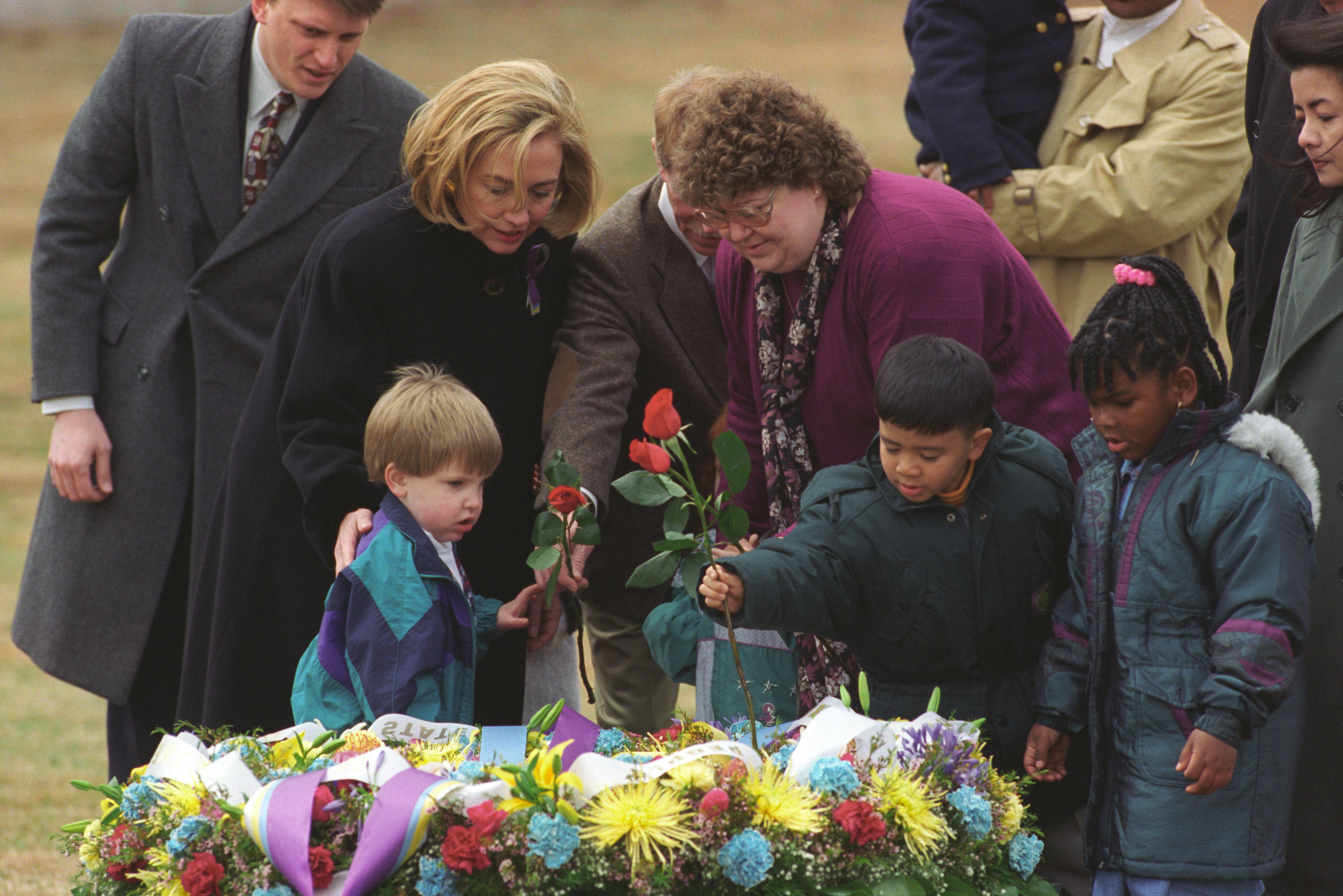 President Clinton and First Lady Hillary Rodham Clinton participate in a wreath laying ceremony with bombing survivors at the former site of the Murrah Federal Building in Oklahoma City