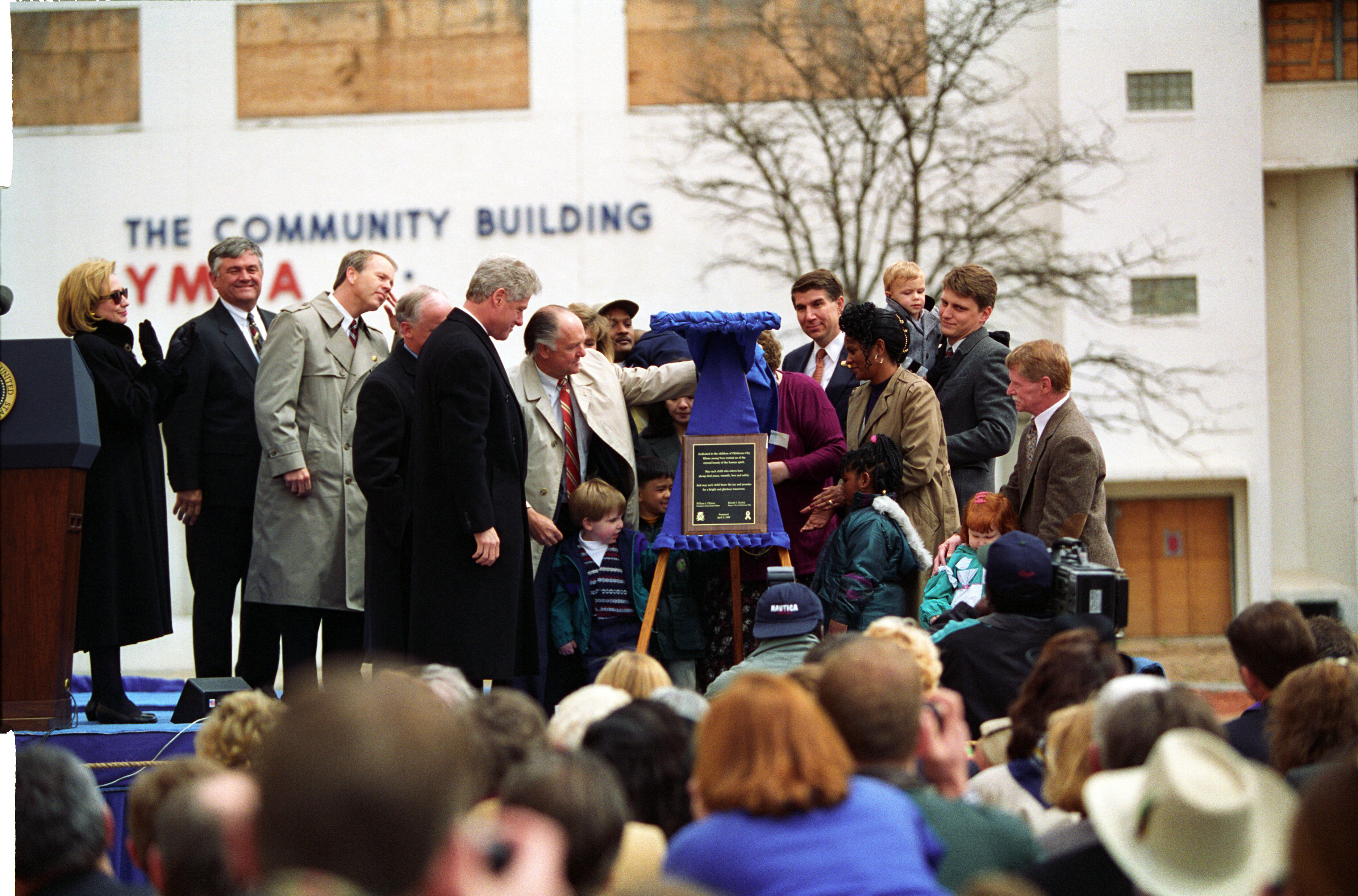 President Clinton and First Lady Hillary Rodham Clinton participate in a plaque dedication for the new YMCA Child Care Center in Oklahoma City