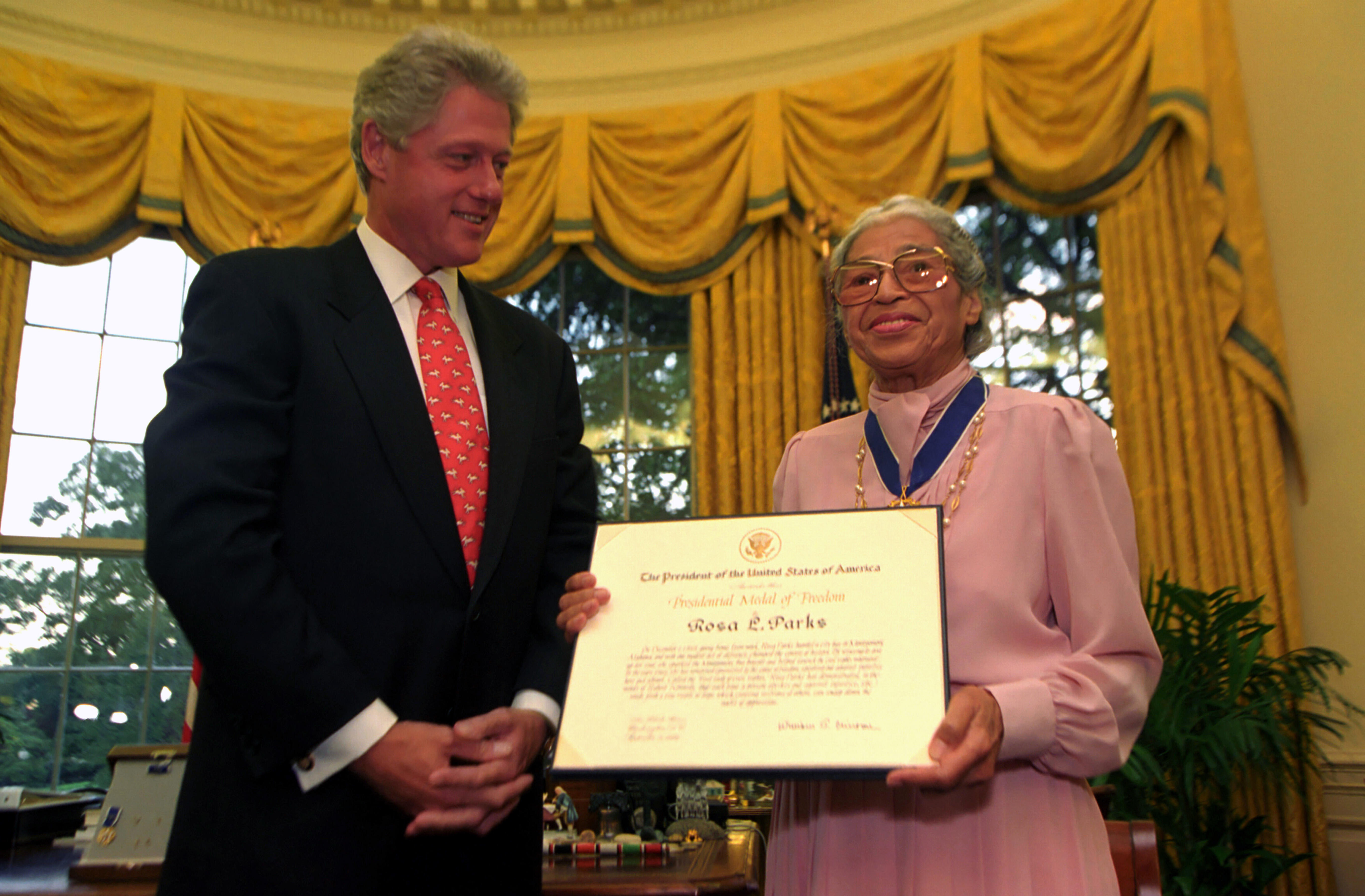 President Clinton presents Rosa Parks with the Presidential Medal of Freedom in the Oval Office