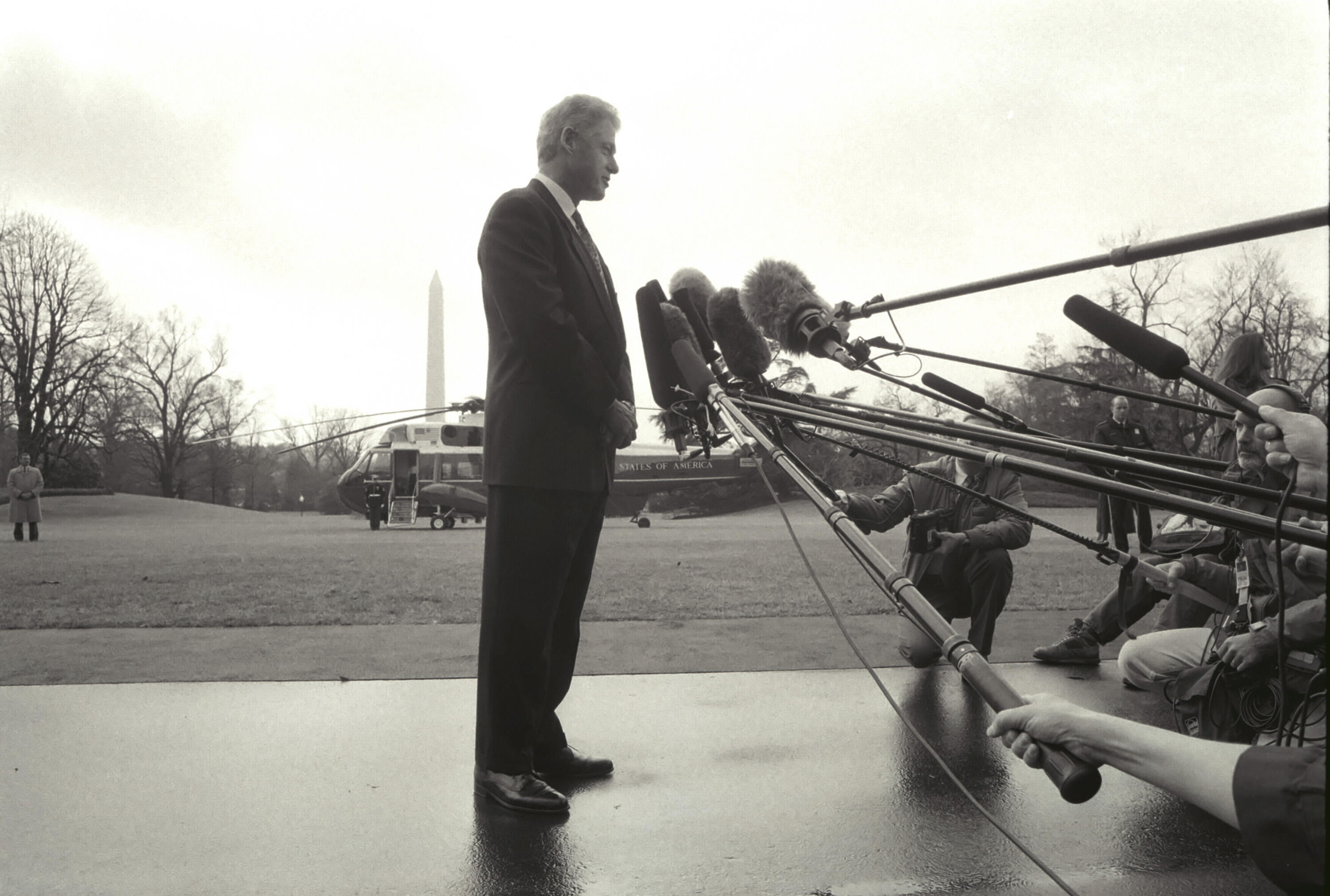 President Clinton makes a statement concerning the death of United States Ambassador to France, Pamela Churchill Harriman. President Clinton makes his statement on the South lawn of the White House and is surrounded by press boom microphones.