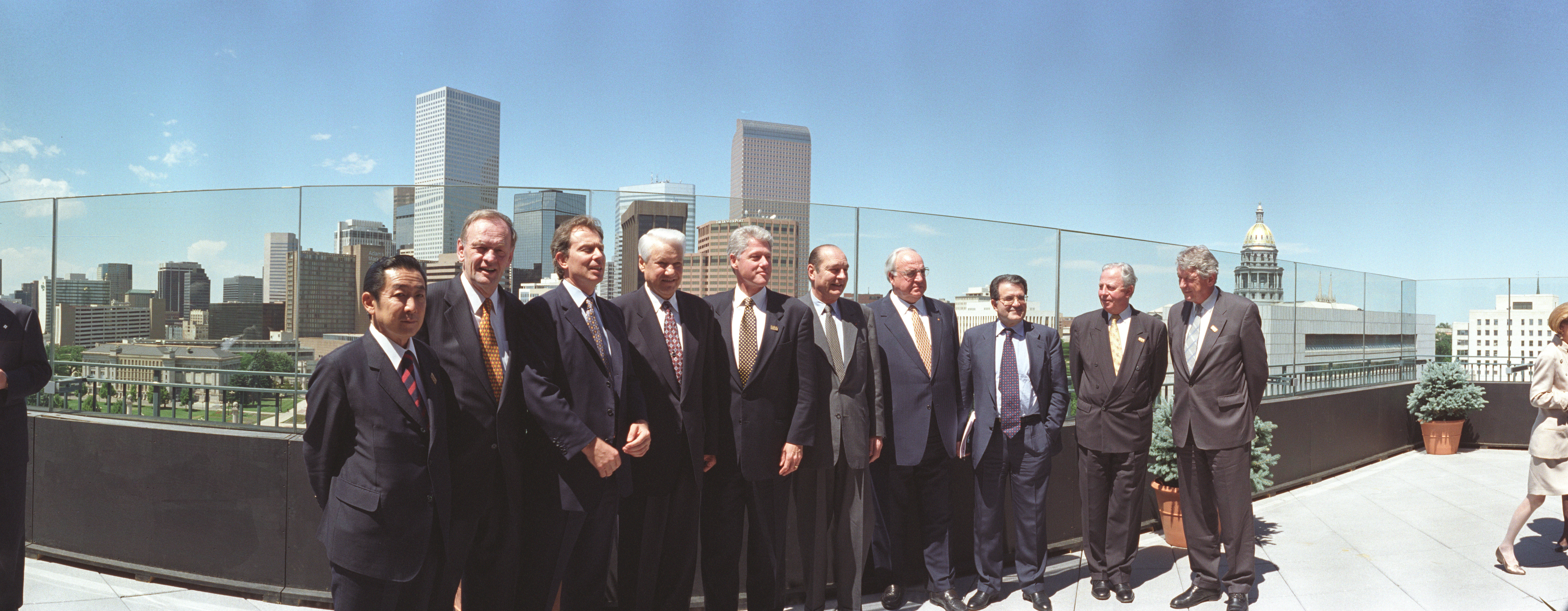 President Clinton meets with the the Summit of Eight Leaders at the Denver Public Library. President Clinton is joined by President Jacques Chirac, President Jacques Santer, Prime Minister Tony Blair, Prime Minister Ryutaro Hashimoto, Chancellor Helmut Kohl, President Boris Yeltsin, Prime Minister Jean Chretien, Prime Minister Romano Prodi, and Prime Minister Wim Kok for a group photo with the Denver Skyline in the background
