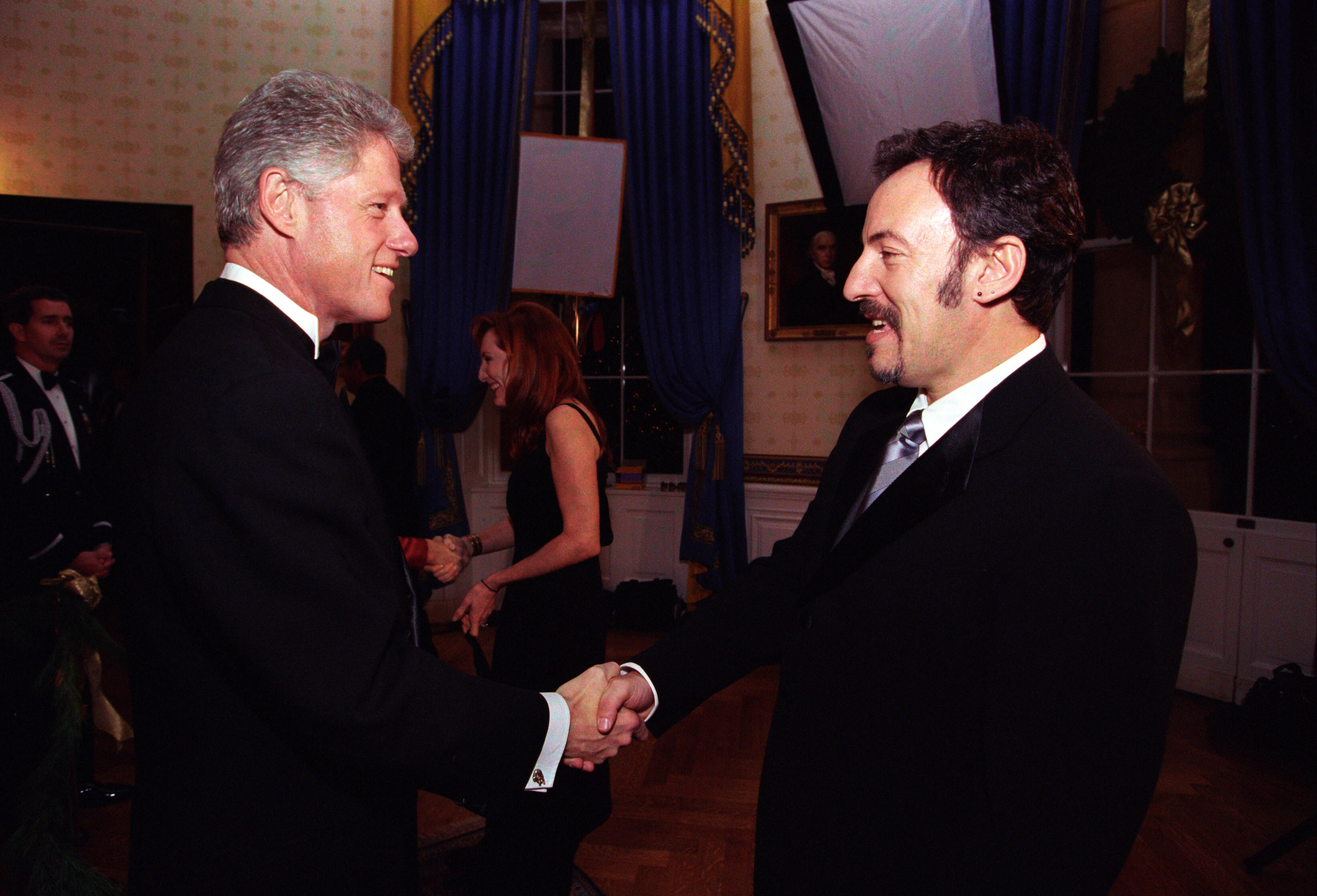 President Clinton greets musician Bruce Springsteen in the Blue Room during the Kennedy Center Honors Reception.