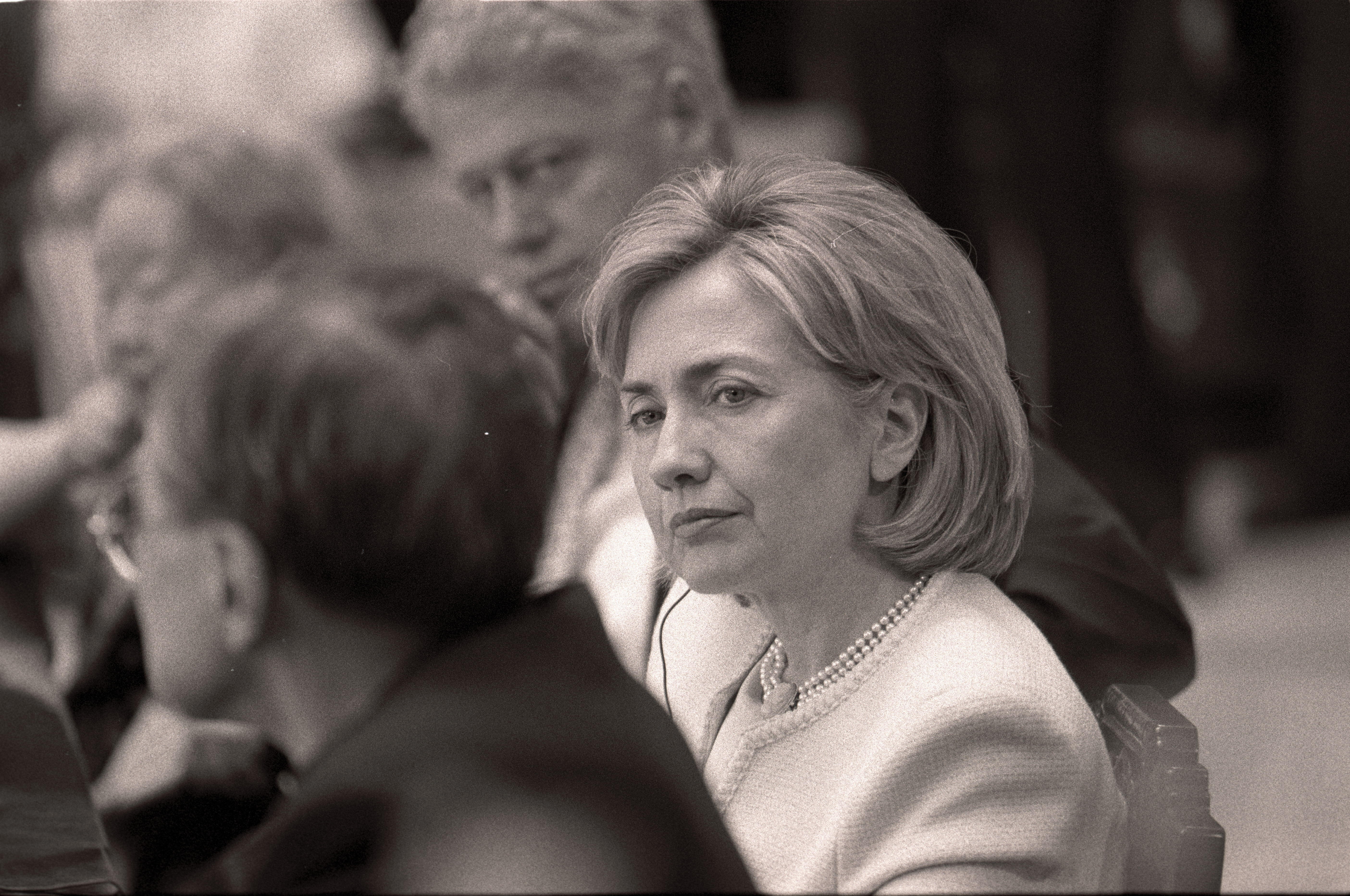 Black and white photograph. President Clinton and First Lady Hillary Rodham Clinton participate in a group discussion: "Looking toward China in the 21st Century," at the Shanghai Library in Shanghai, China