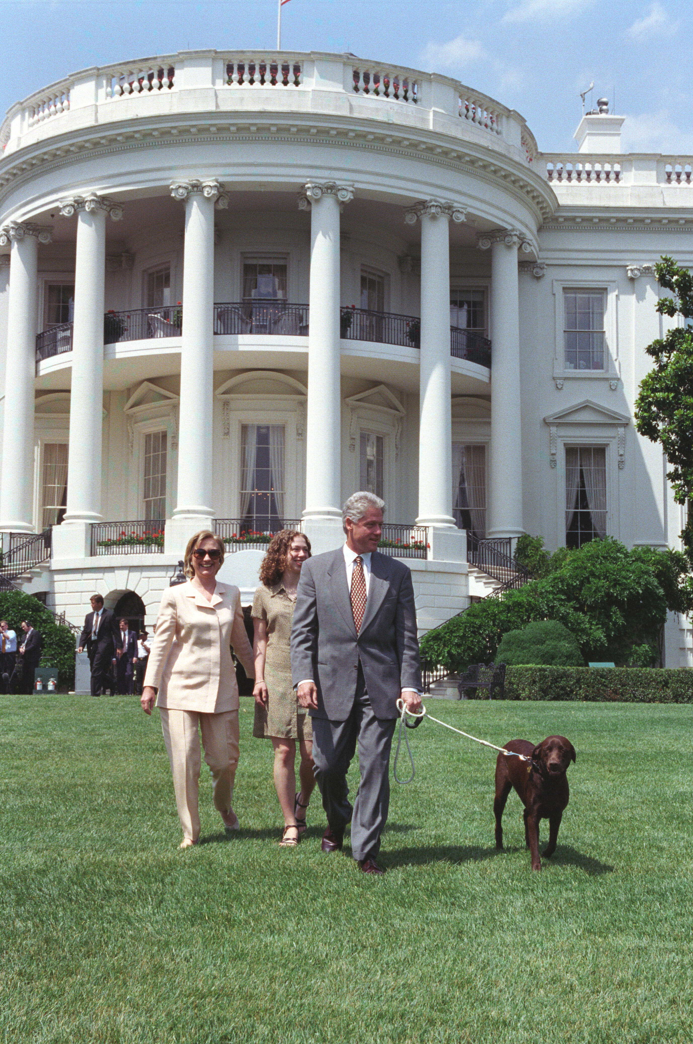 The President, First Lady, and Chelsea walk to Marine One with Buddy the Dog on the South Lawn of the White House