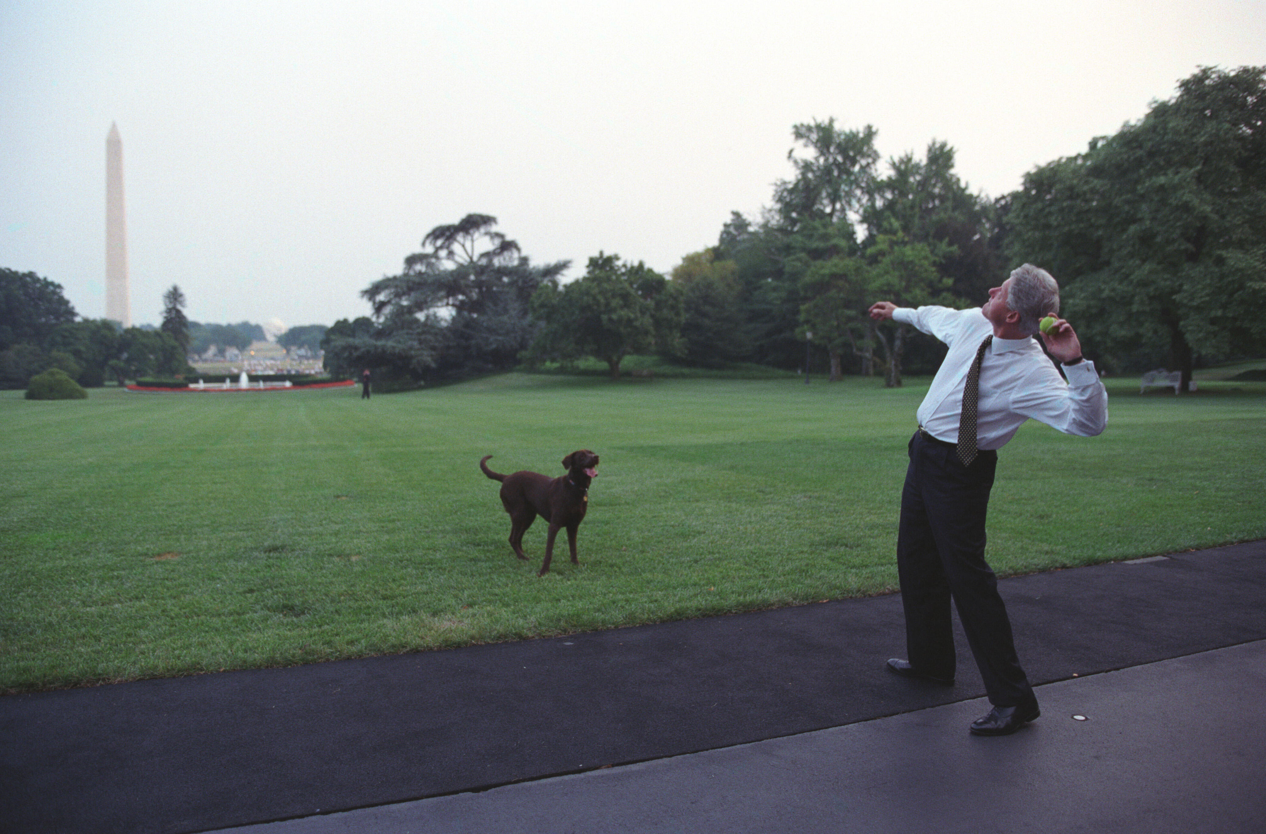 The President throws a ball to Buddy the Dog at the White House