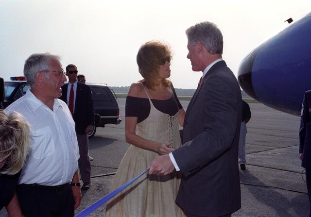 President Clinton greets entertainer Carly Simon on the tarmac at Martha's Vineyard Airport