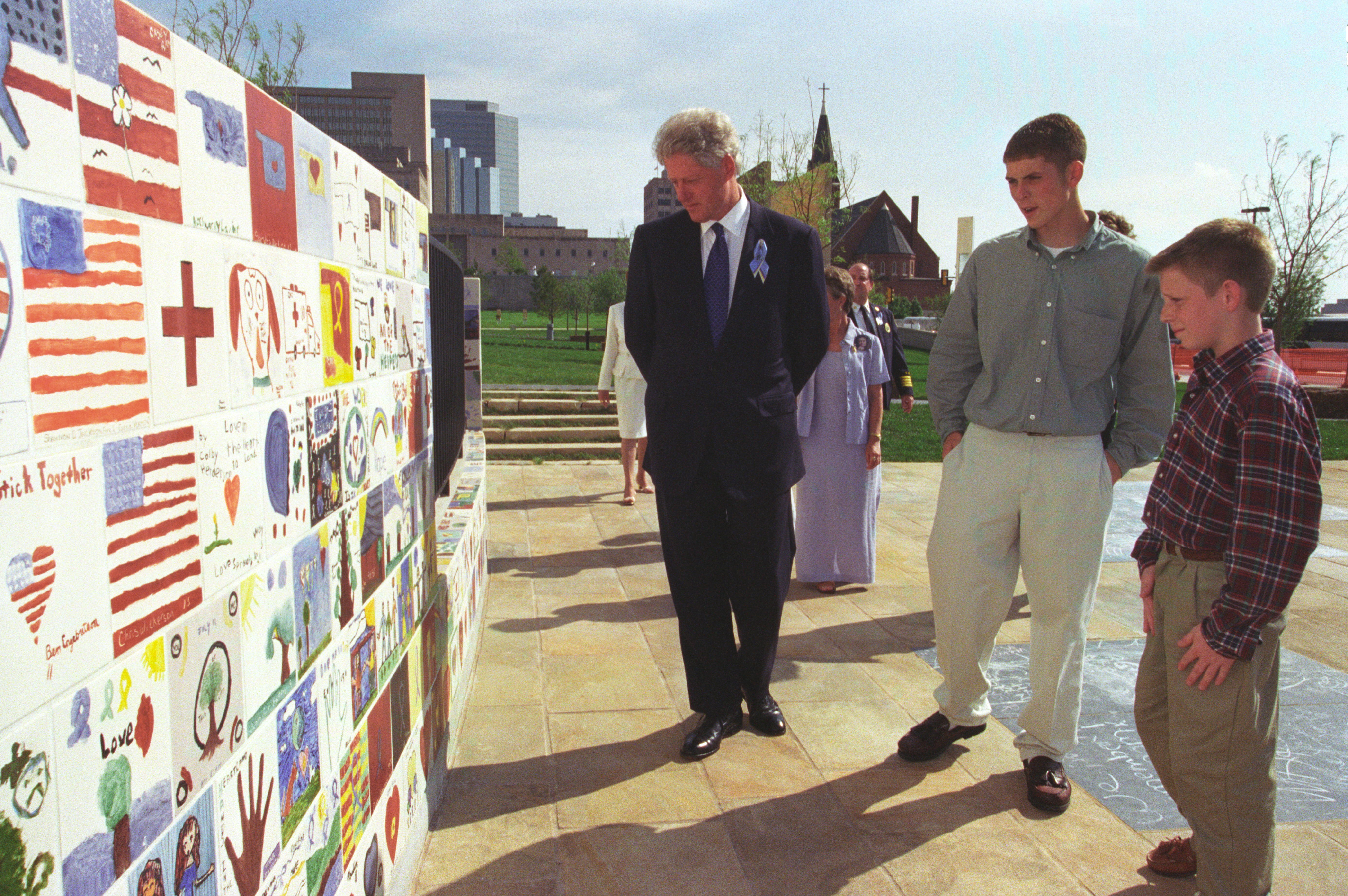President Clinton looks at children's art work displayed at the Oklahoma City National Memorial