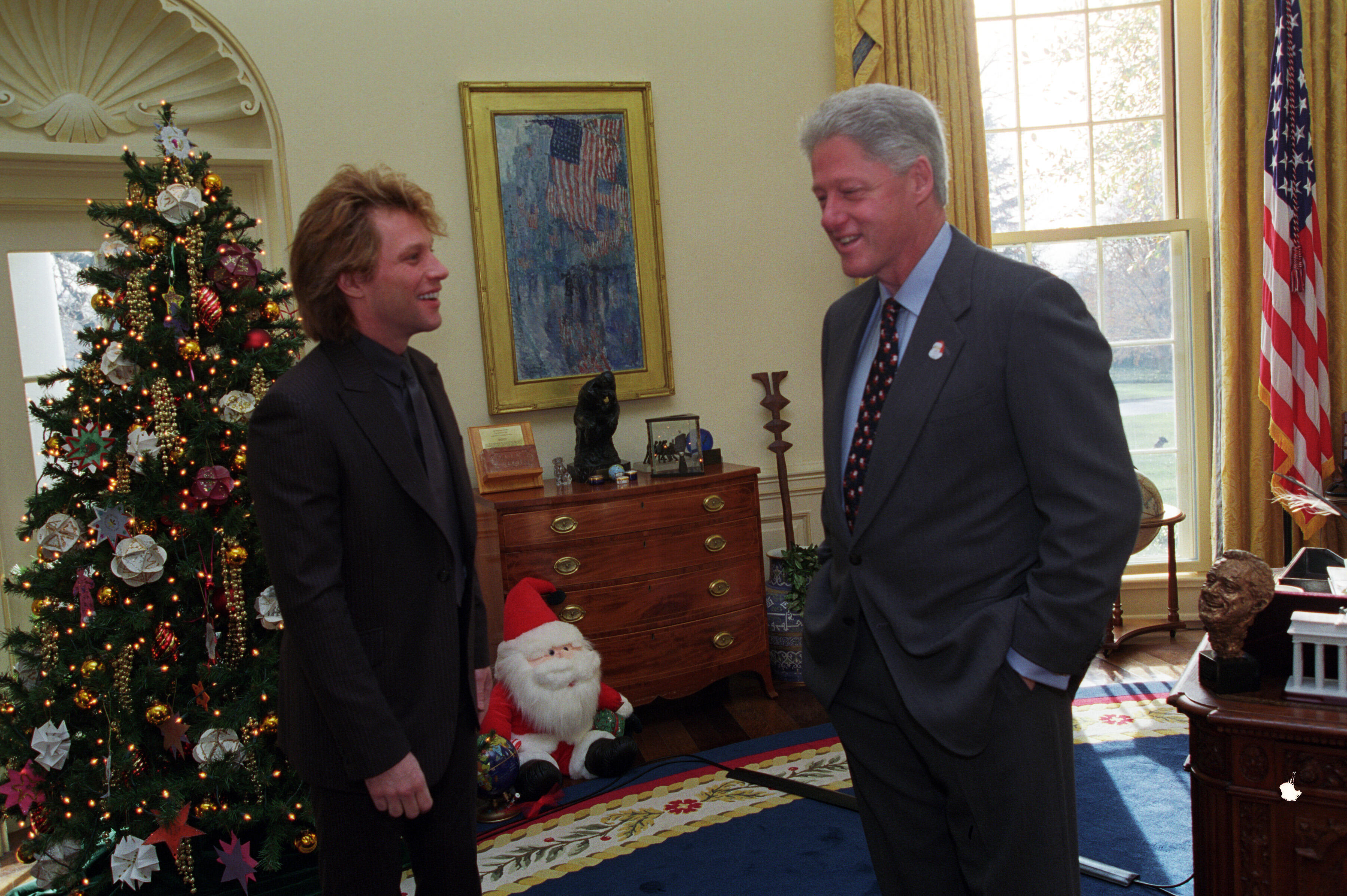 President Clinton talks with musician Jon Bon Jovi in the Oval Office