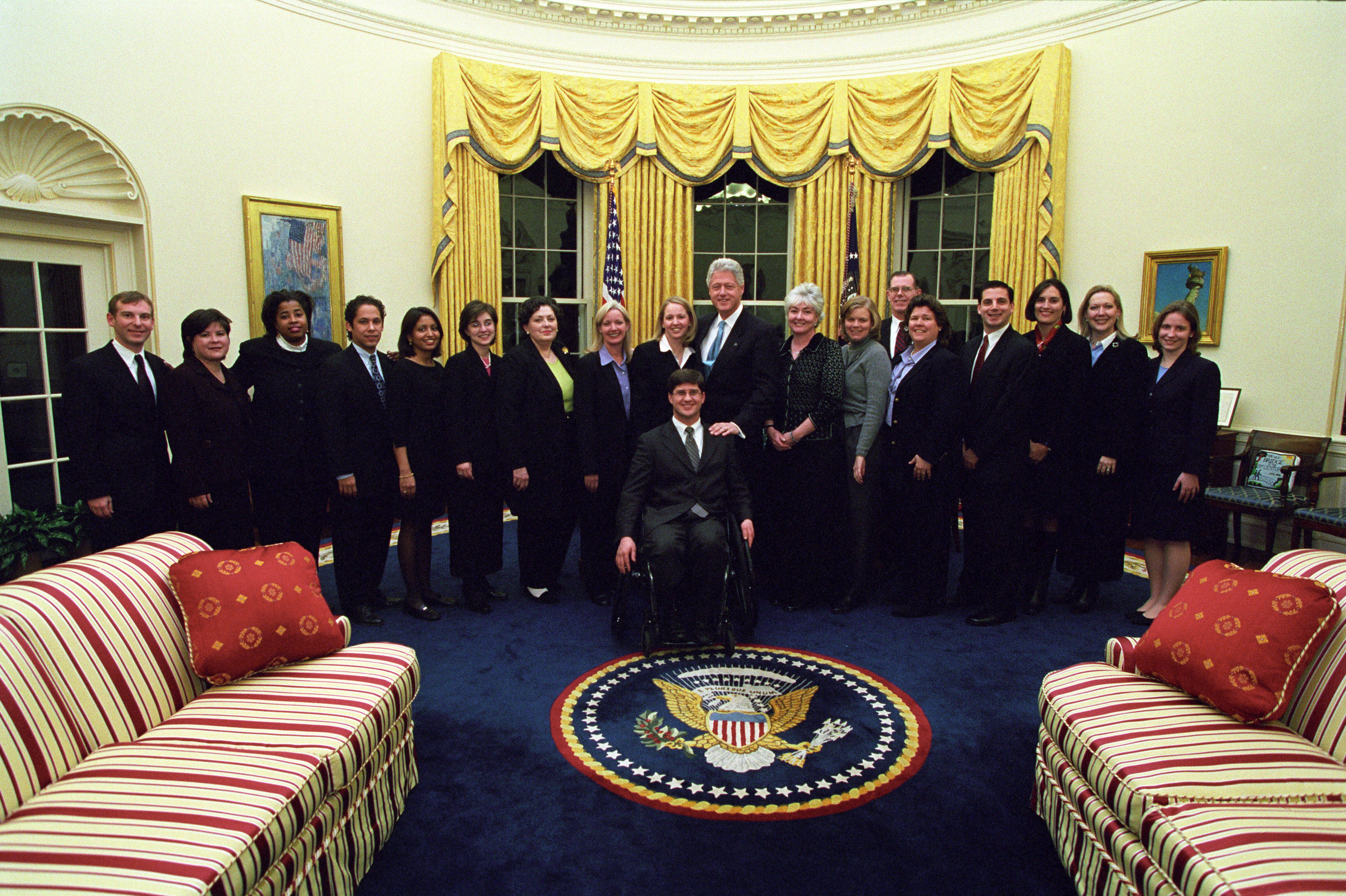 President Clinton joins the staff of the Public Liaison Office for a group photo in the Oval Office