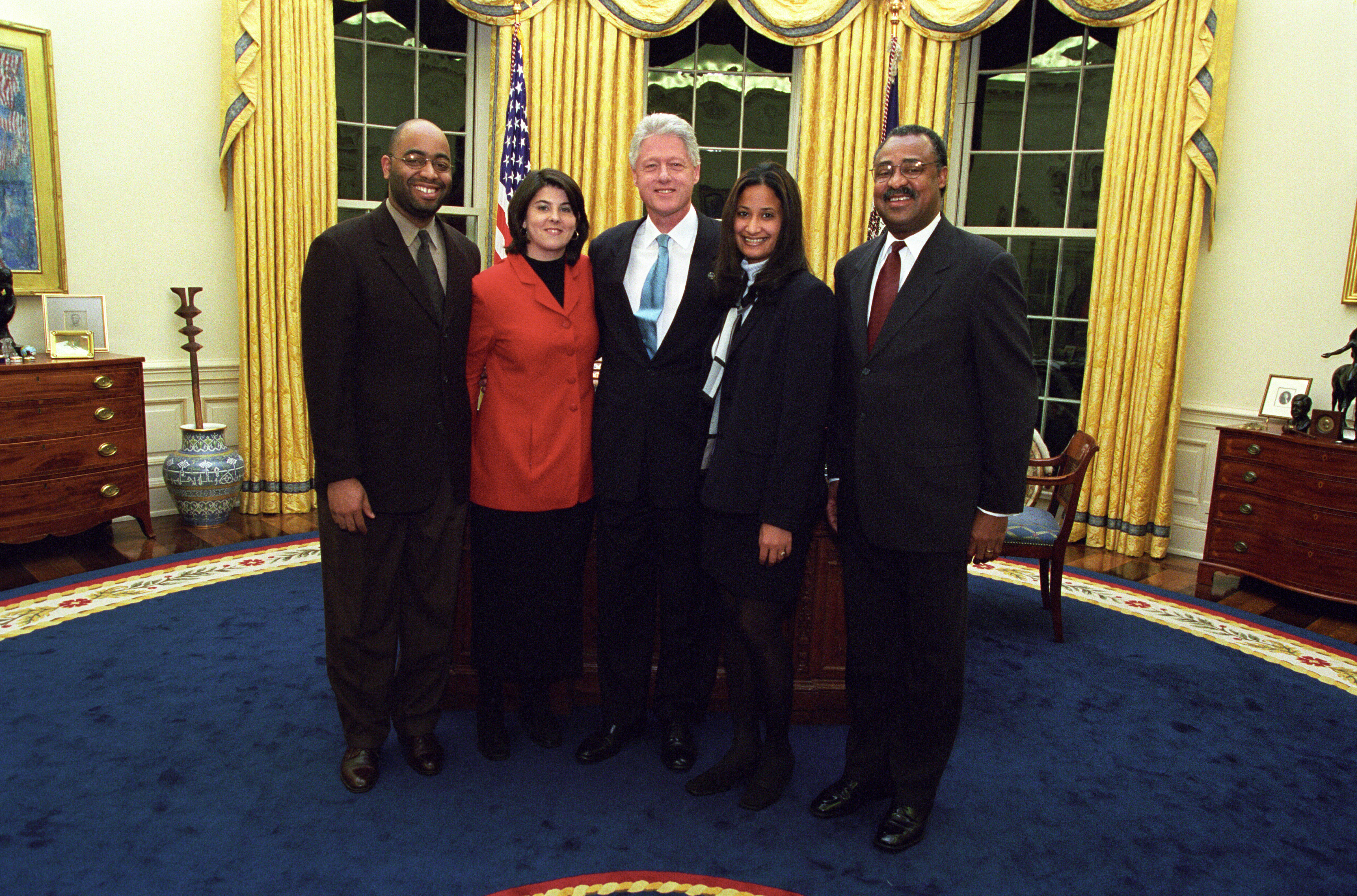 President Clinton joins the staff of the One America Office for a group photo in the Oval Office