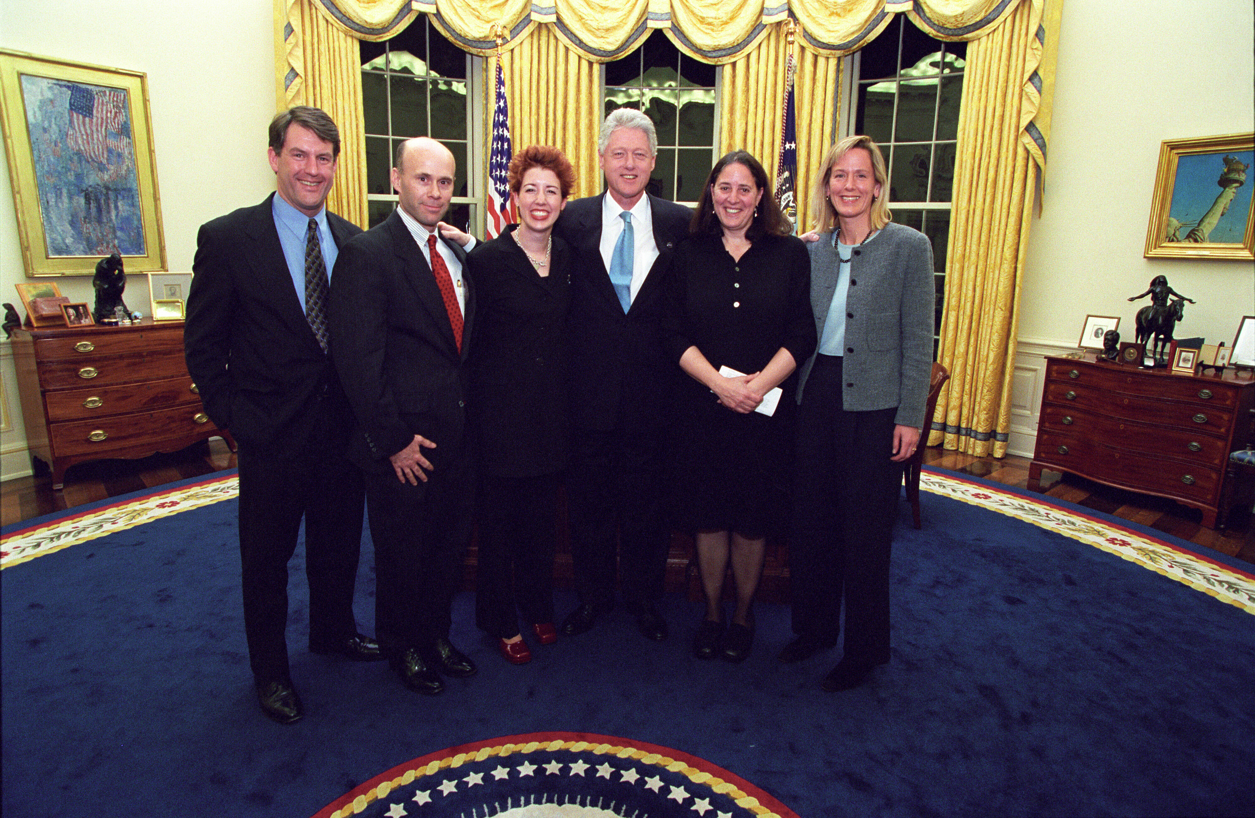 President Clinton joins the staff of the Environment Initiatives Office for a group photograph in the Oval Office