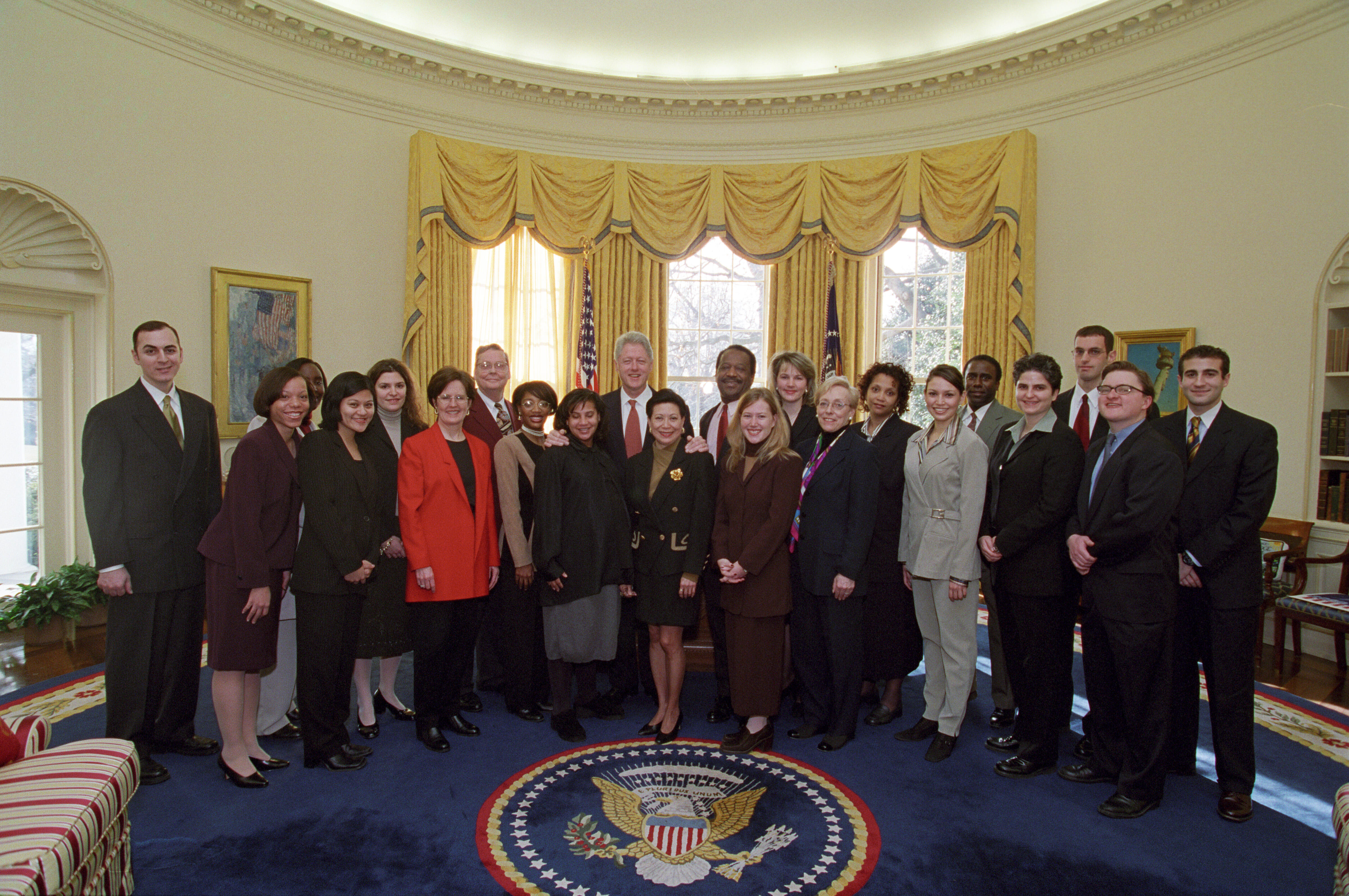 President Clinton joins the staff of the Presidential Personnel Office for a group photo in the Oval Office