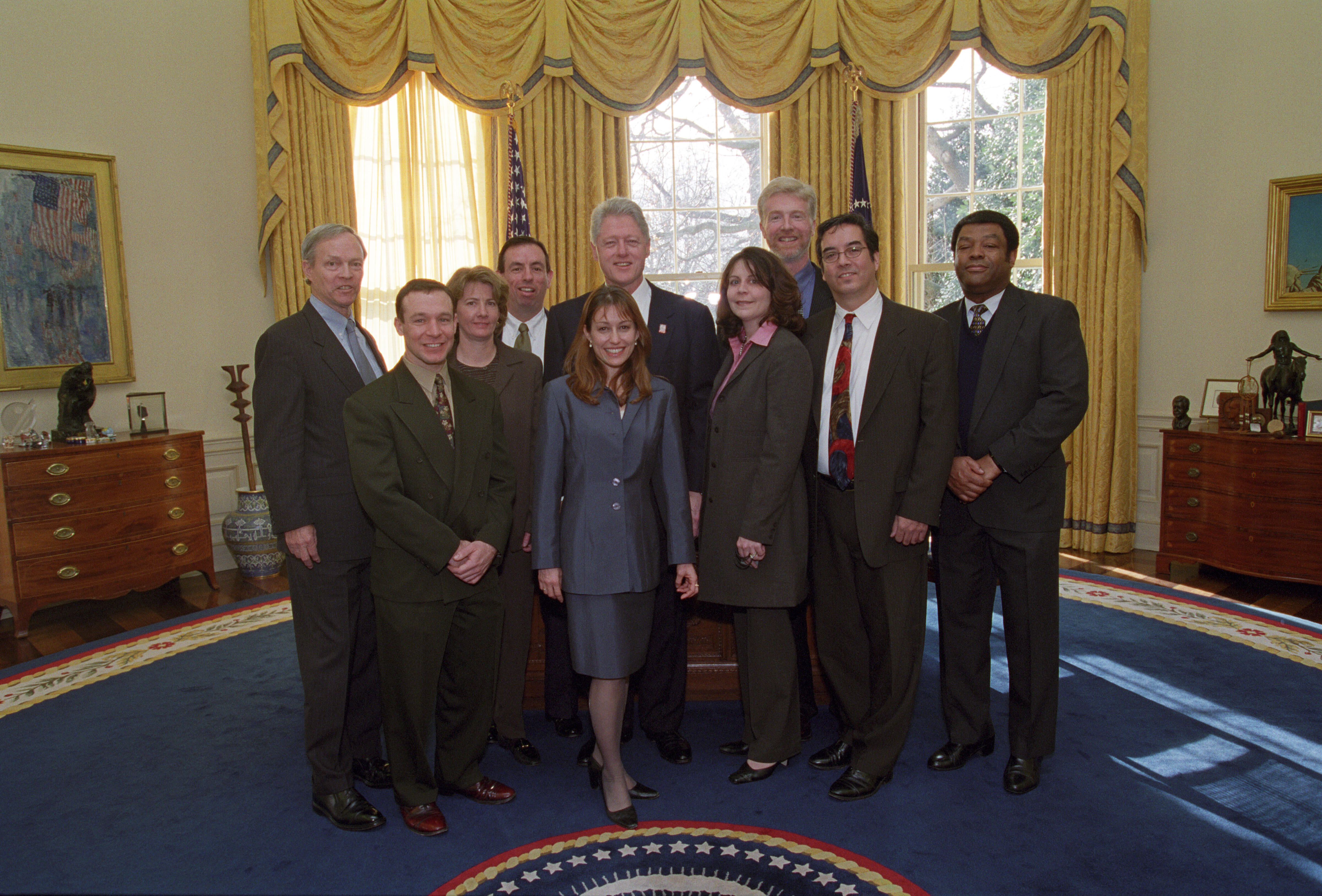 President Clinton joins the staff of the Office of the Special Envoy for a group photo in the Oval Office